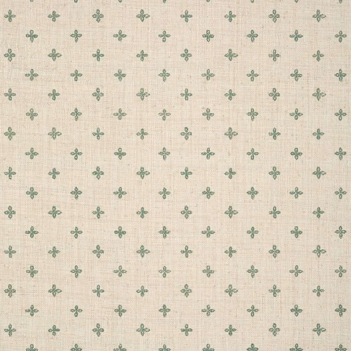 Cream linen fabric with small green fleur-de-lis motif repeat pattern, ideal for elegant upholstery and decor.