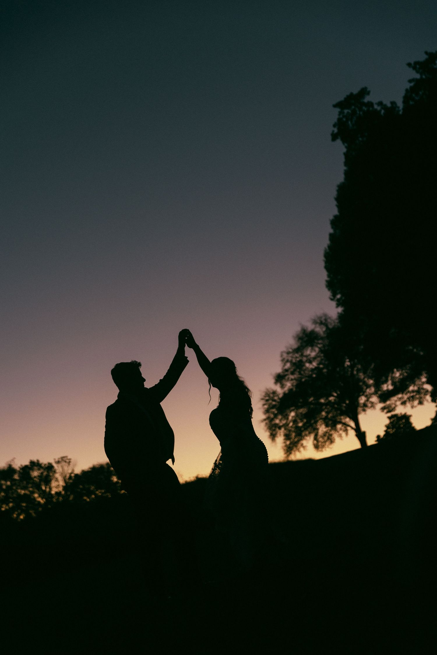 Romantic silhouette of couple dancing at sunset on there wedding day in Roanoke, VA