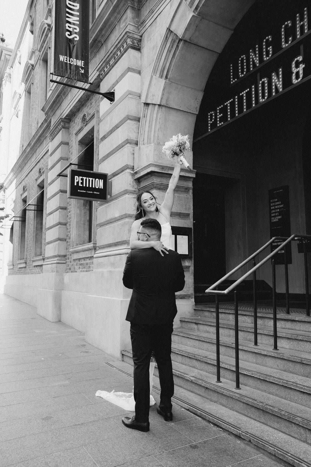 Candid wedding photos in Perth CBD capturing romantic couple portraits in urban city streets, natural light, documentary style photography