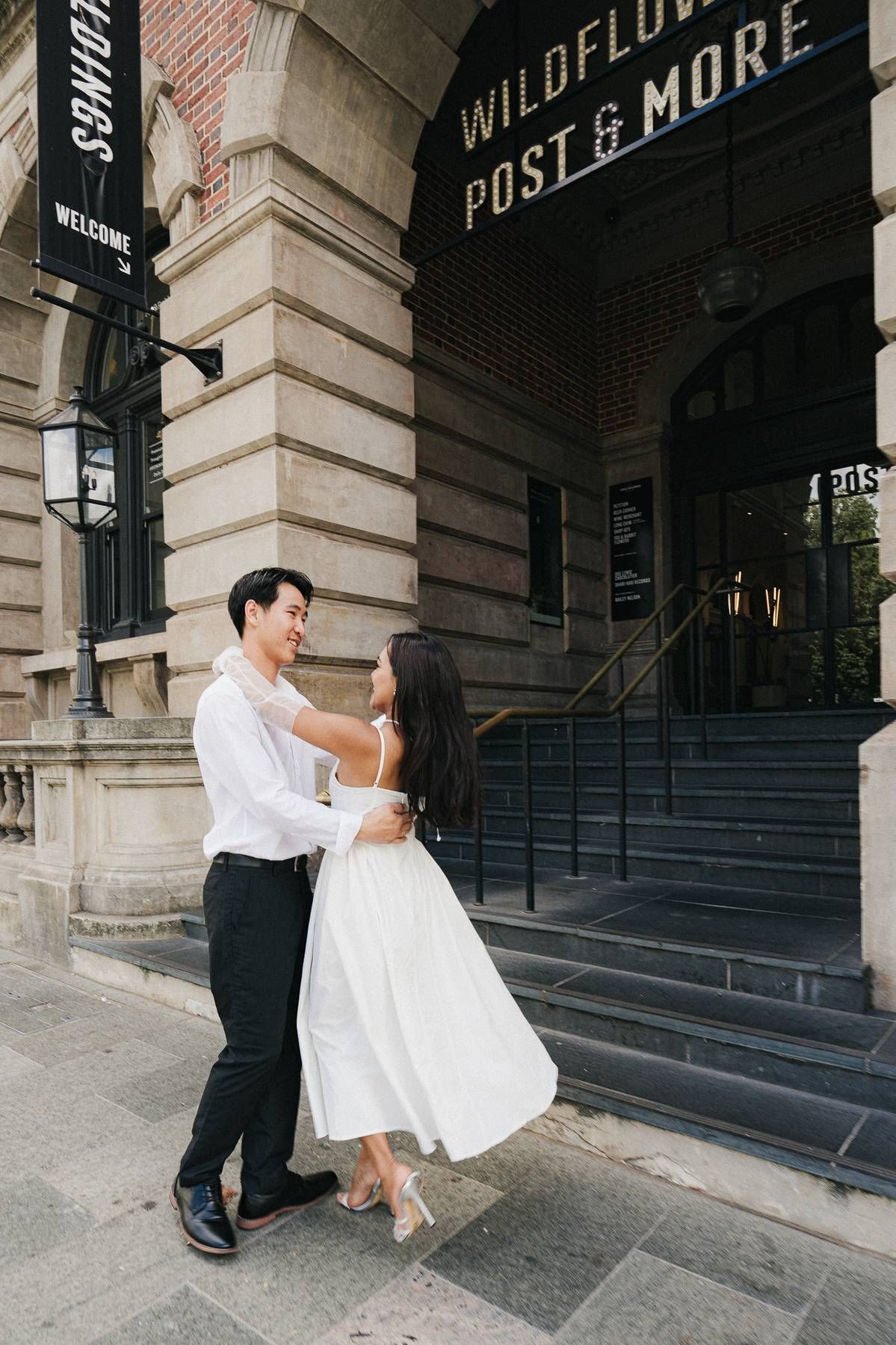 Candid wedding photos in Perth CBD capturing romantic couple portraits in urban city streets, natural light, documentary style photography