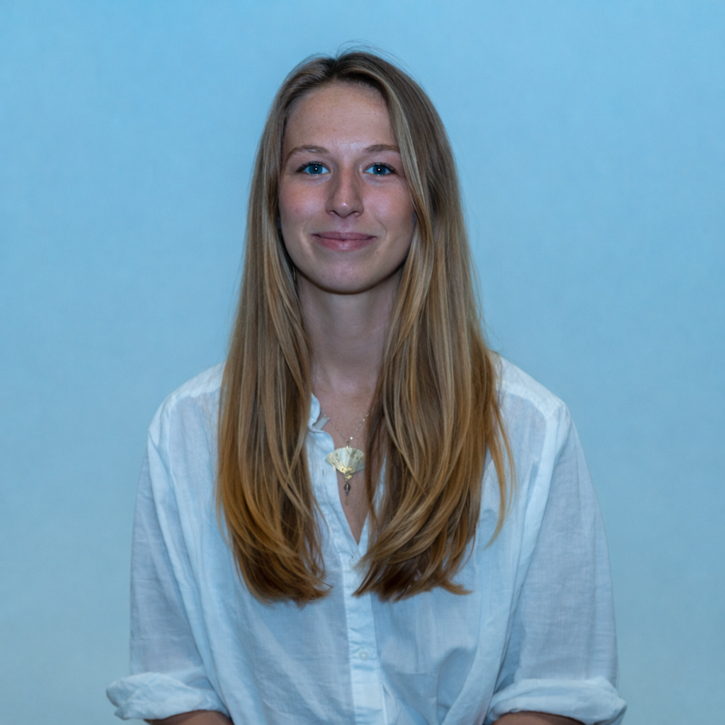 Professional studio-style headshot of a woman in a white button-down shirt, captured by Shane Anthony Photography