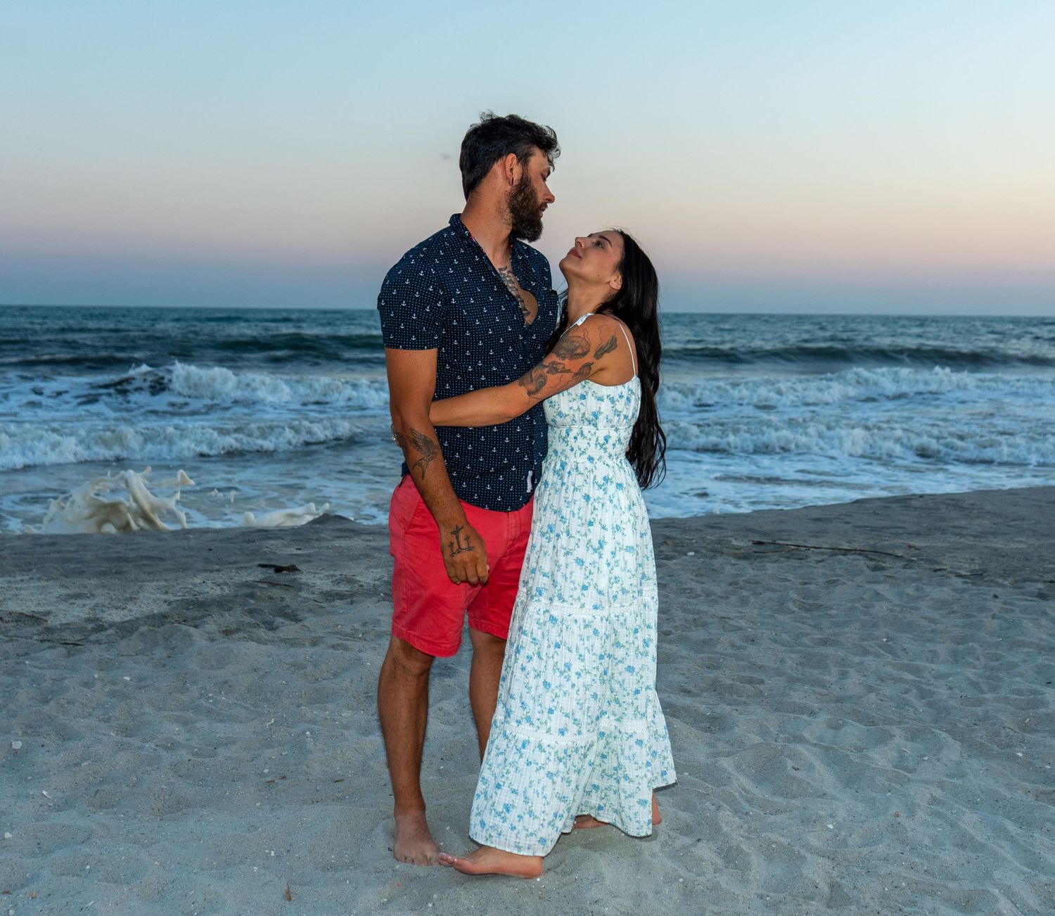 Candid beach lifestyle photography of a couple at sunset, showcasing authentic moments by Shane Anthony.