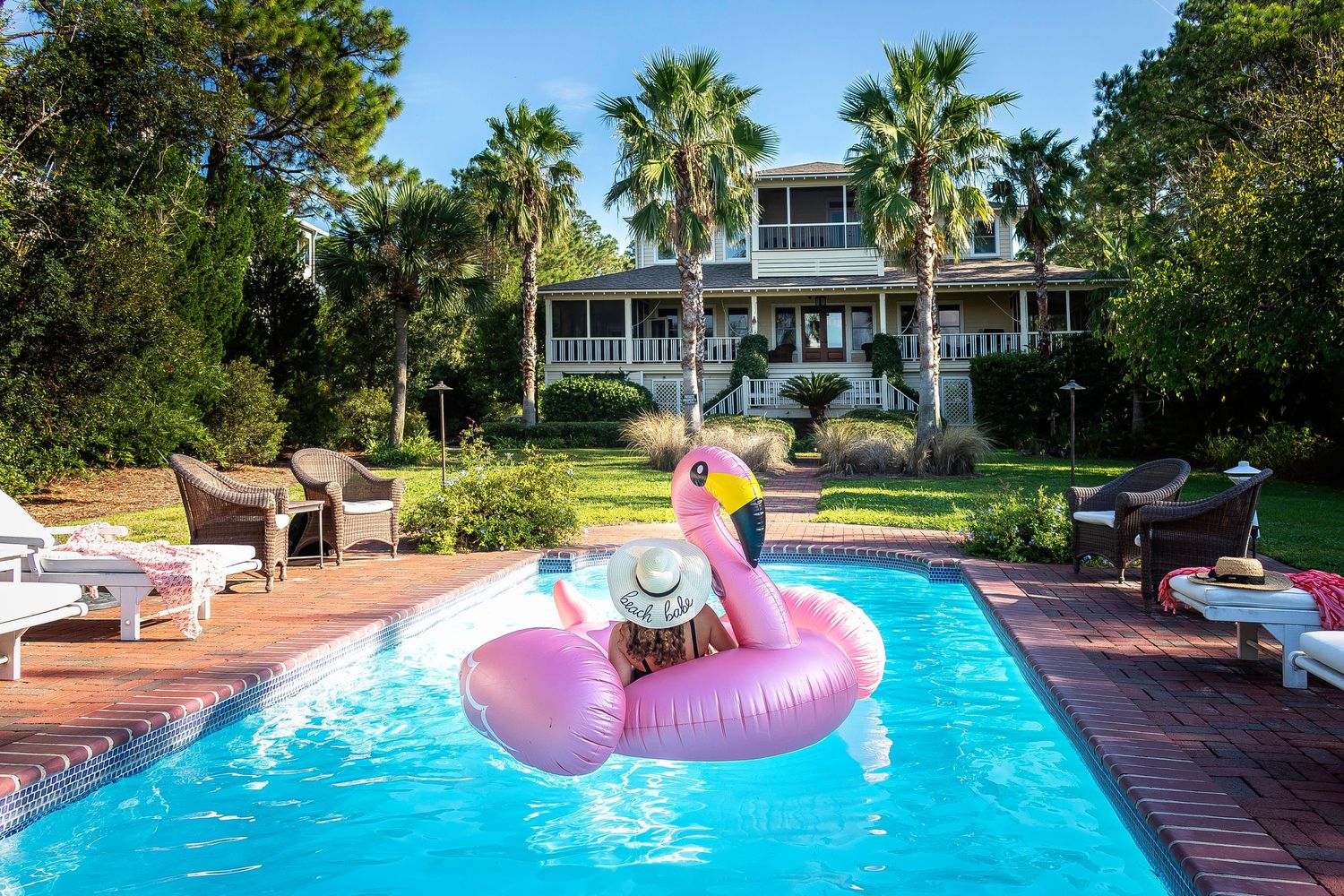 Woman relaxing on a pool float at a Tybee Island vacation rental