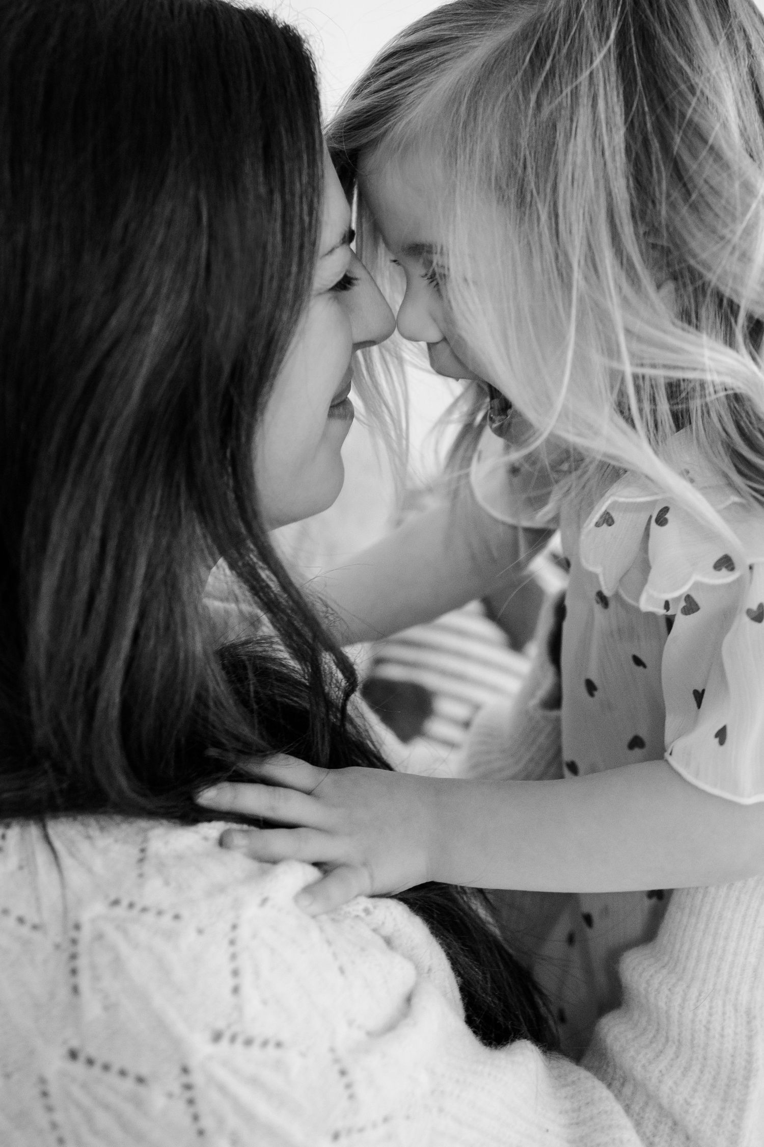 Black and white close-up shot showing tender moments between mom and child during studio session in Brownsburg, IN by Katy Rose Photography