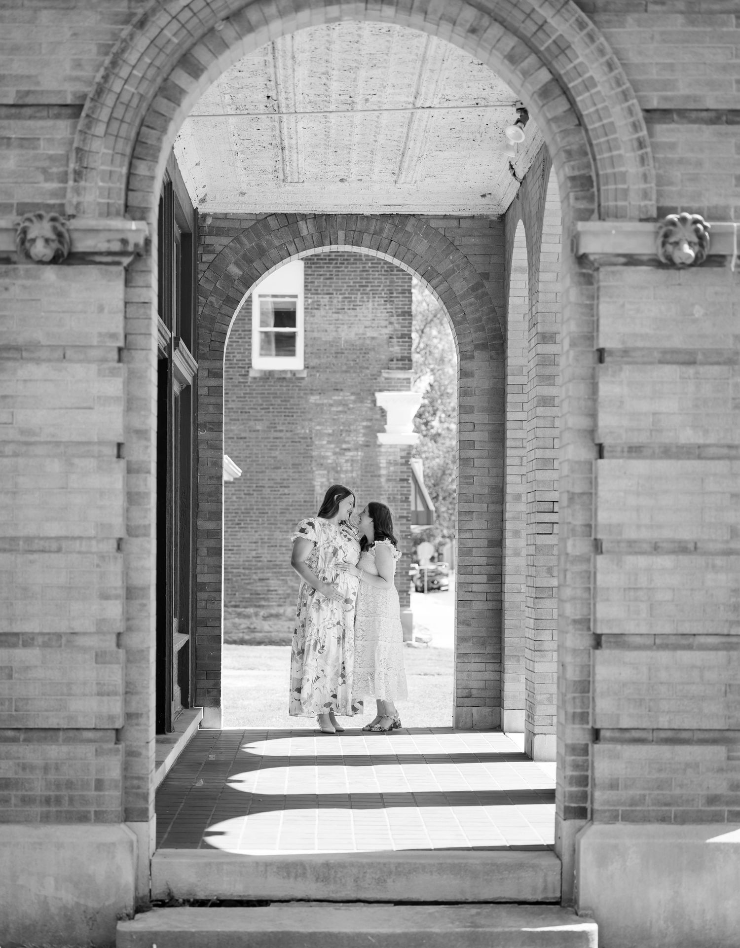 Architectural series showing brick archways and sunlit corridors.