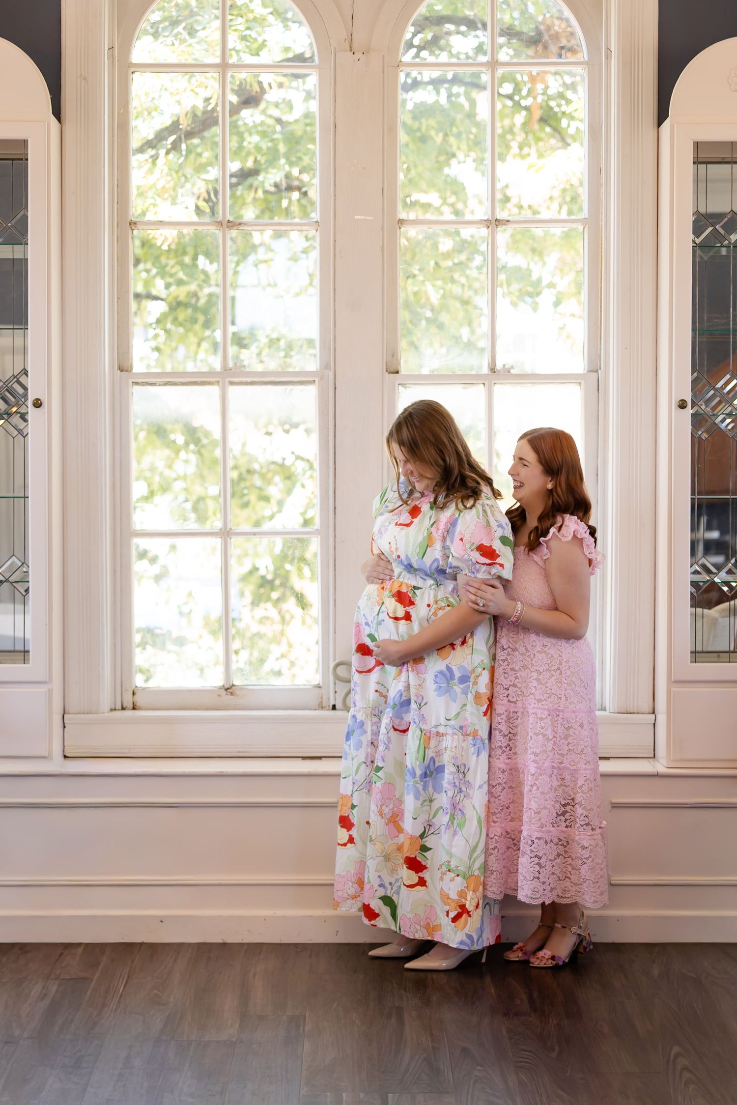 A series of photos showing two people in floral and lace dresses by sunlit windows.