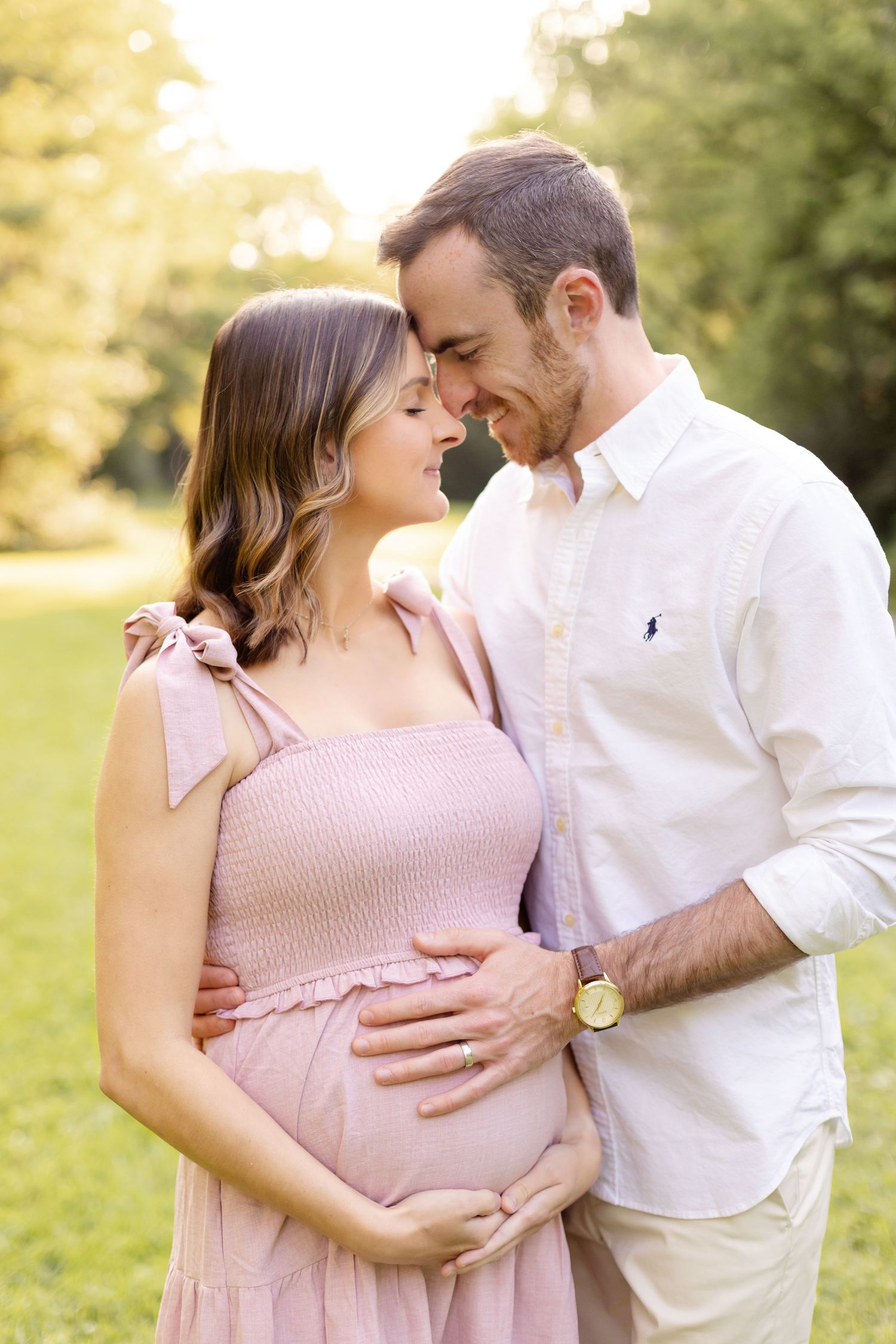 Intimate maternity portrait of couple sharing tender moment outdoors during maternity portraits by Katy Rose Photography in Greenwood, IN