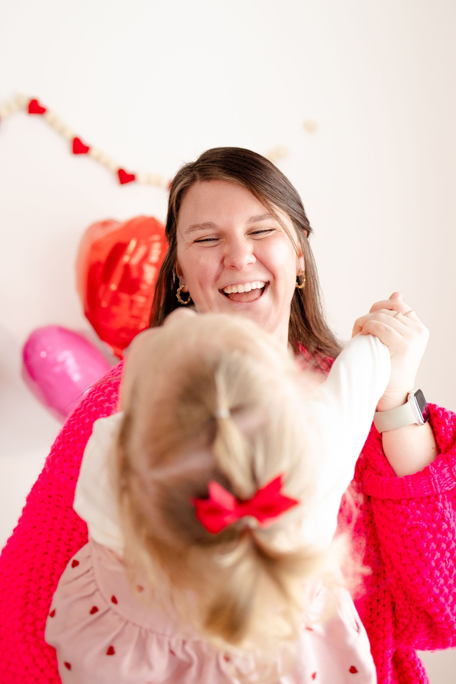 A joyful moment captured between mom and daughter during Valentine's Day Mini Session in Brownsburg, IN by Katy Rose Photography