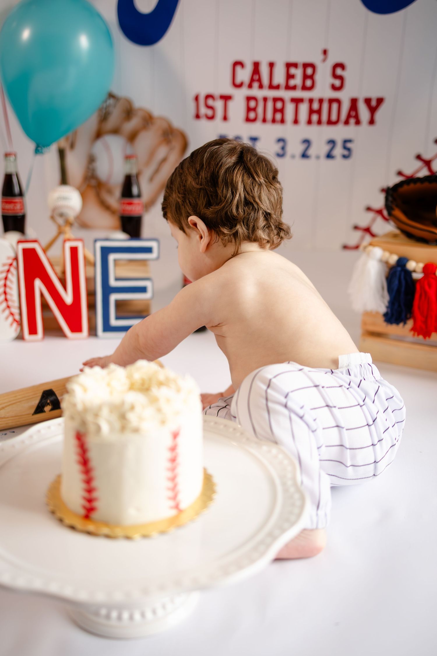 A baseball-themed first birthday smash cake session in Brownsburg, IN by Katy Rose Photography.