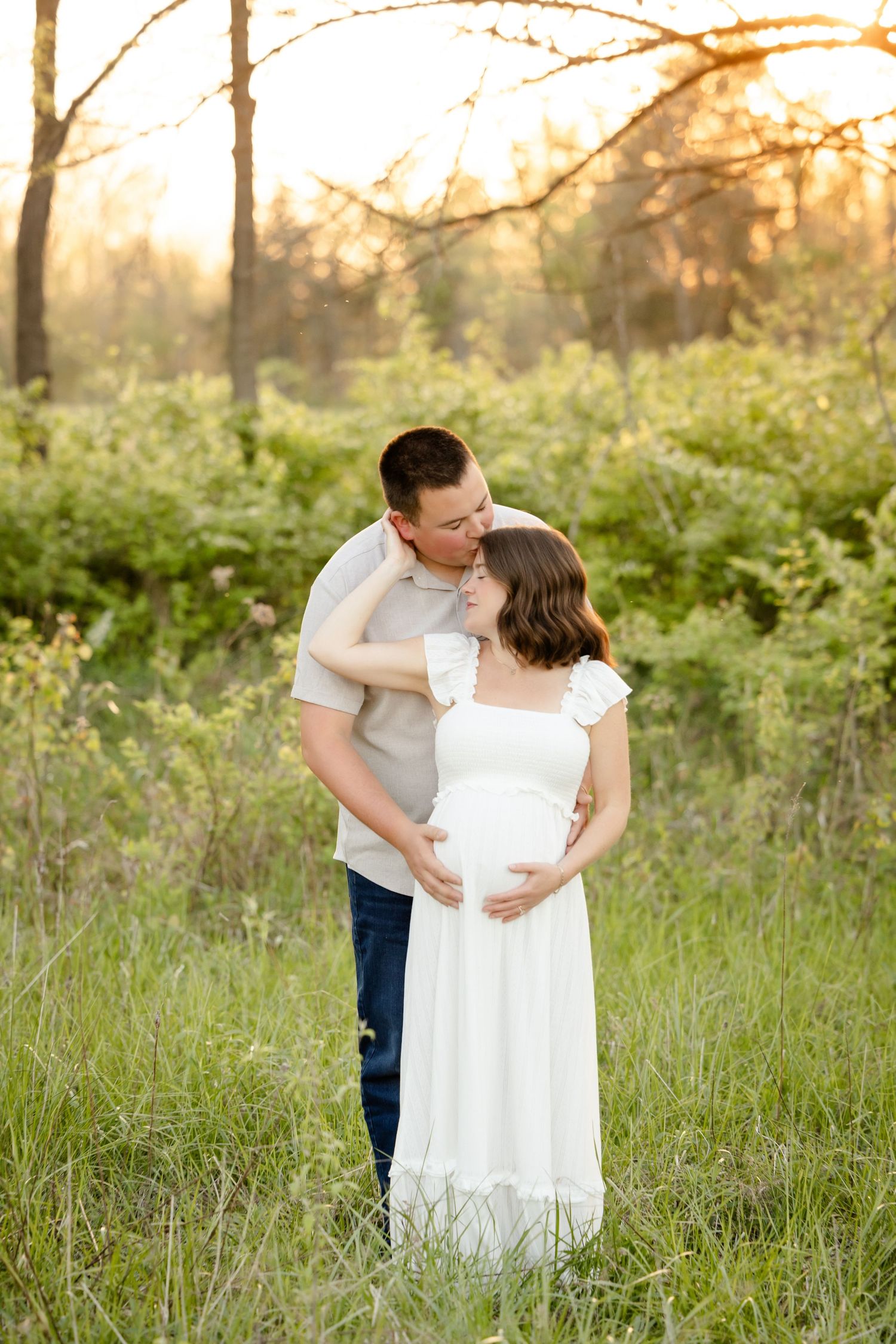 Couple sharing a tender maternity moment during Avon, Indiana maternity session by Katy Rose Photography.