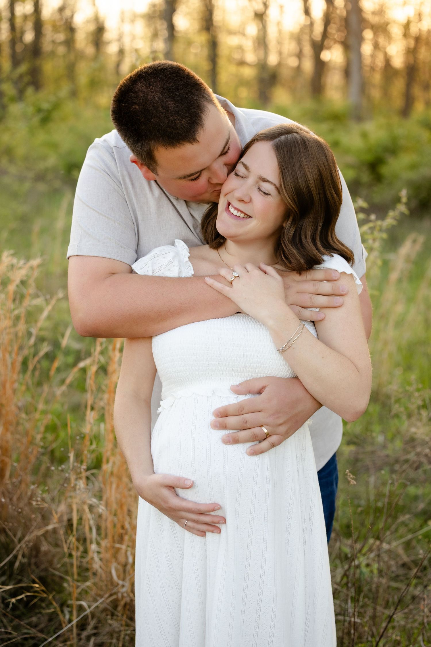 A couple shares a tender moment during Avon, Indiana Maternity Photography Session by Katy Rose Photography at W.S. Gibbs Park.