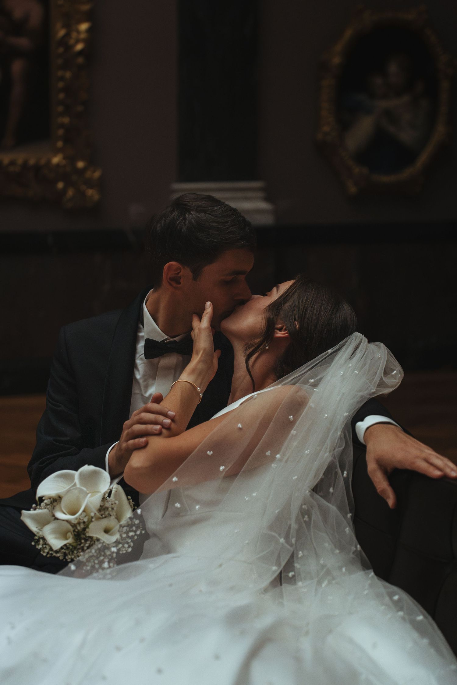 A romantic wedding kiss sequence showing multiple angles of a couple embracing in formal attire with a white veil.