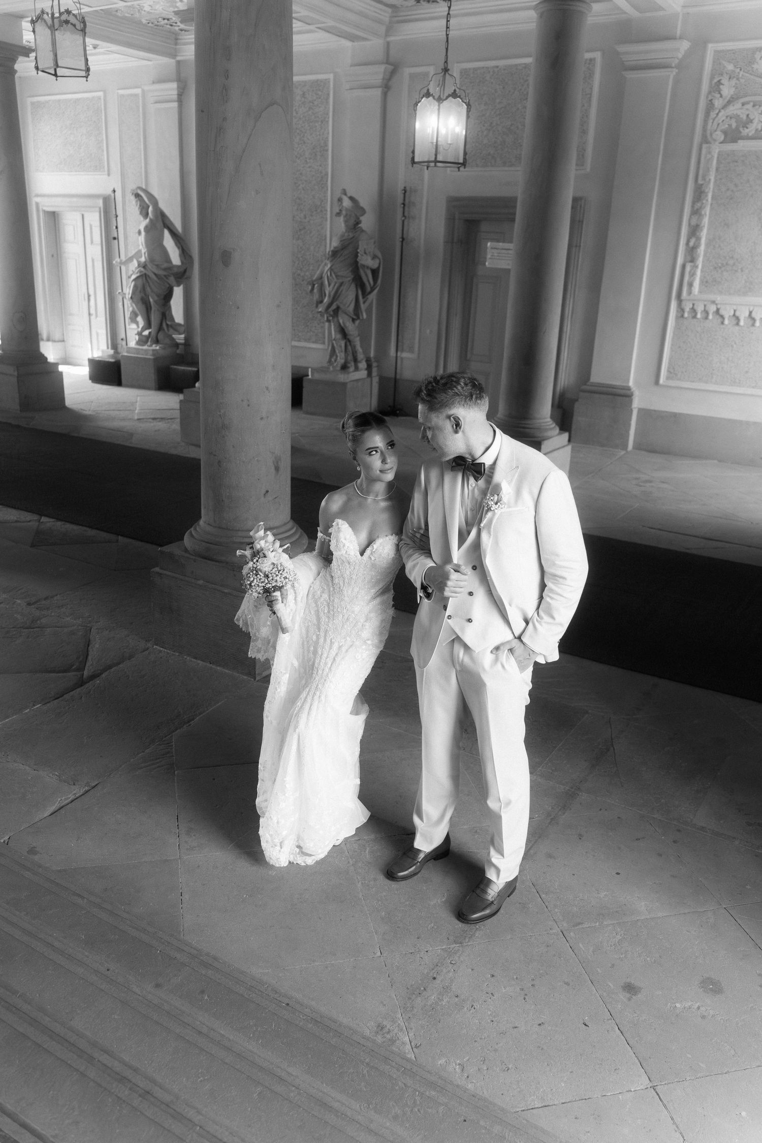 A black and white photo sequence shows a couple in white attire dancing together in an elegant hallway. Schloss Ludwigsburg