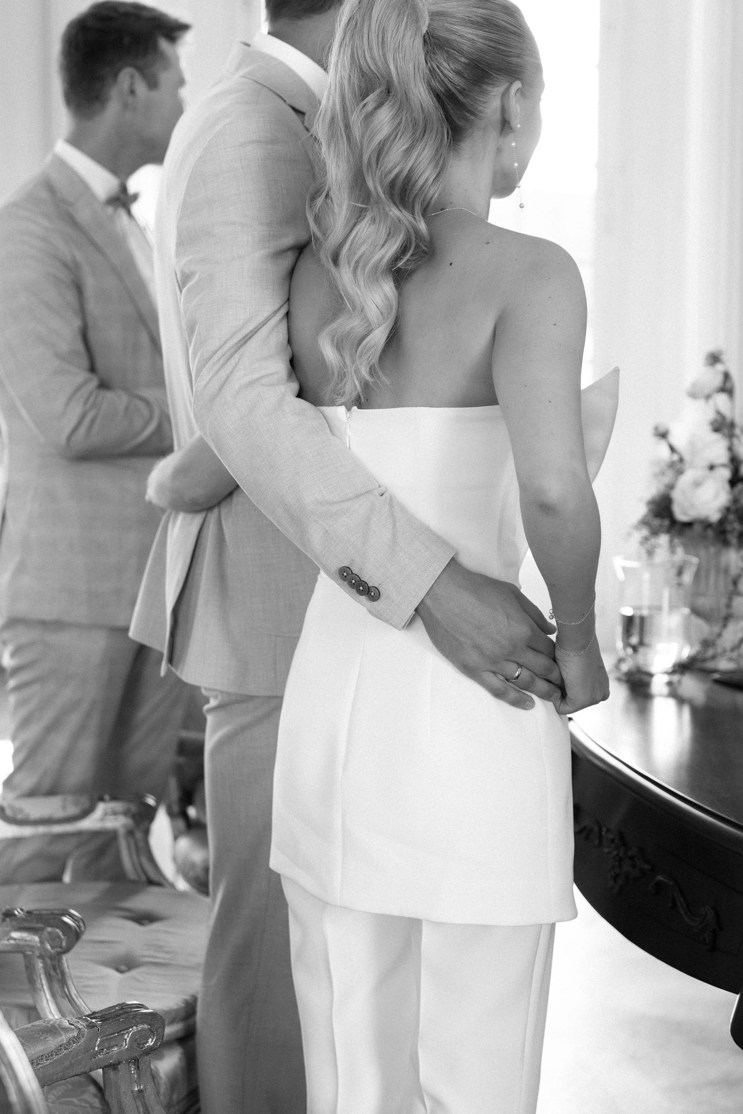 A series of romantic black and white wedding photos showing intimate moments between a couple in formal attire. Schloss Solitude