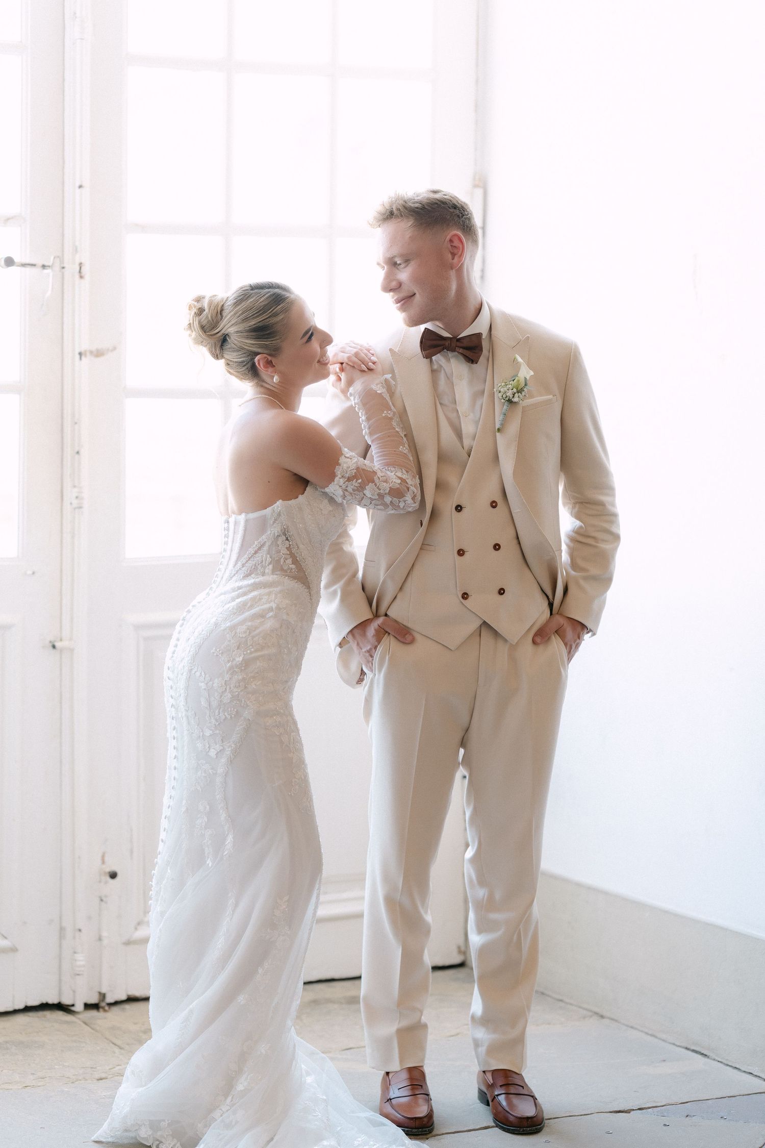 Couple in wedding attire sharing intimate moments against white backdrop in three sequential photos. Schloss Ludwigsburg