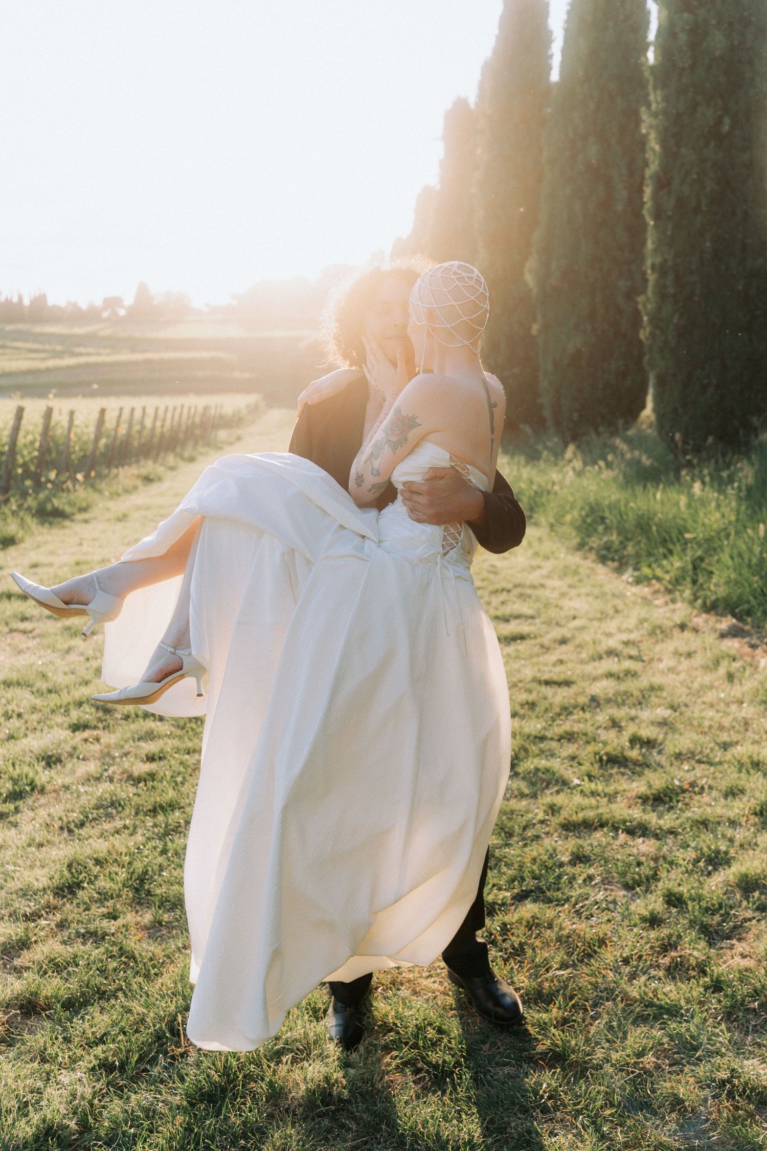 A series of four images showing a flowing white dress swaying in golden sunlight against a grassy field backdrop.