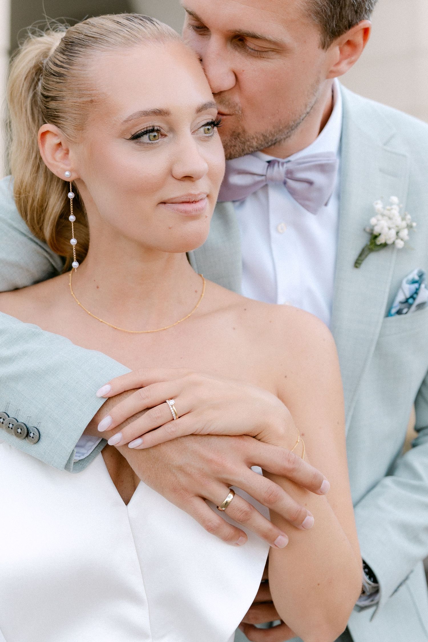 A romantic wedding photo collage showing tender moments between a couple in white and light colored formal attire. Schloss Solitude