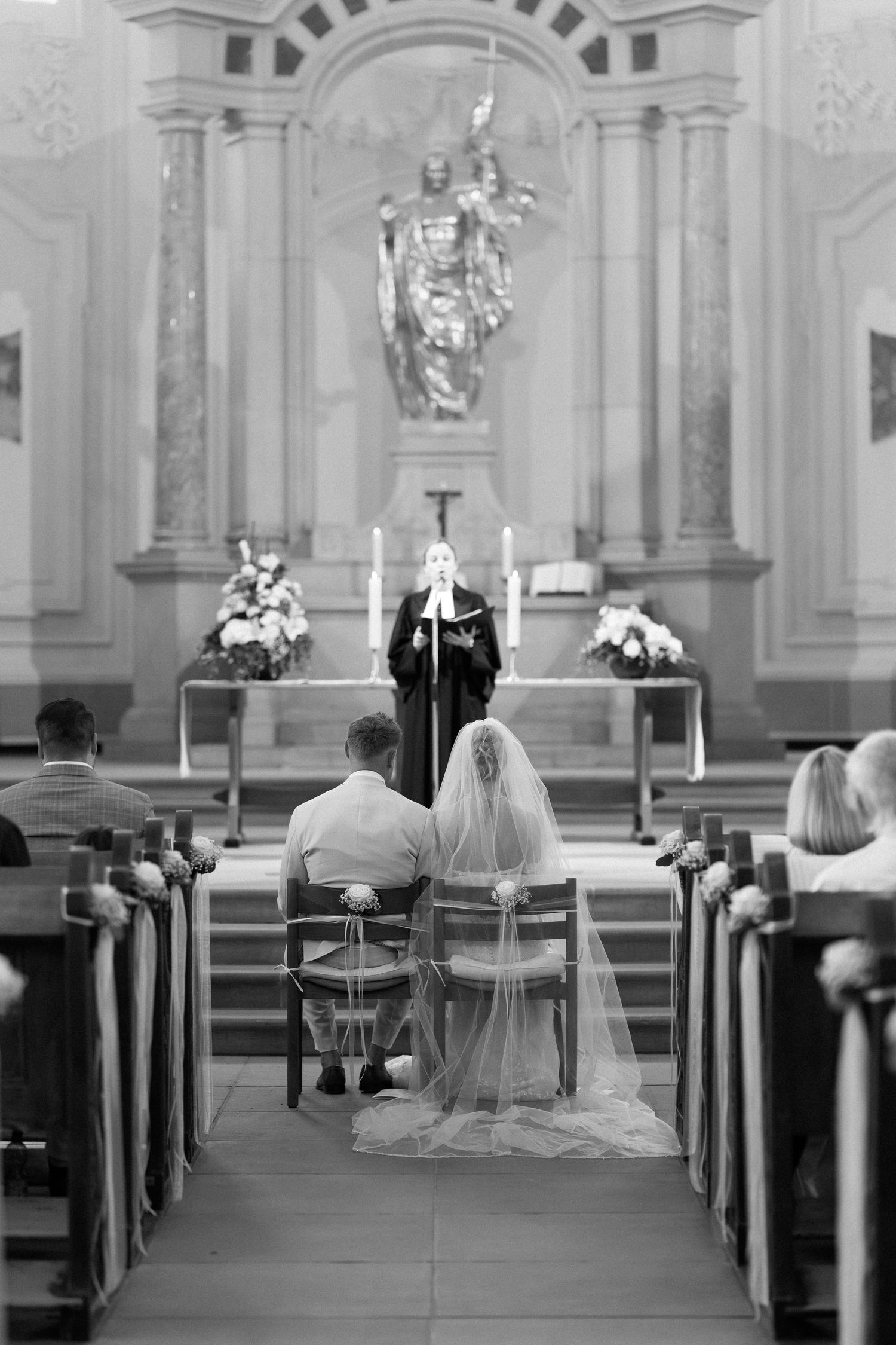 A black and white photo sequence shows a traditional church wedding ceremony with figures seated in wooden pews.