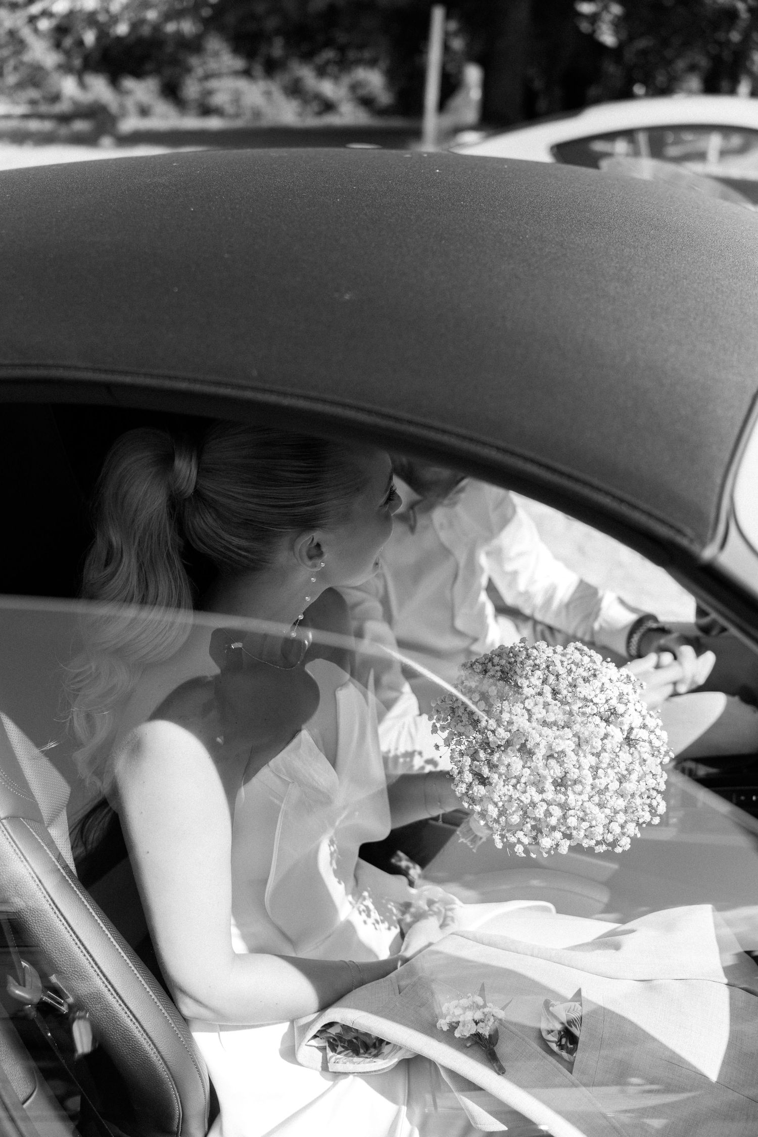 A black and white photo sequence shows someone sitting in a car seat and moving across multiple frames. Schloss Solitude