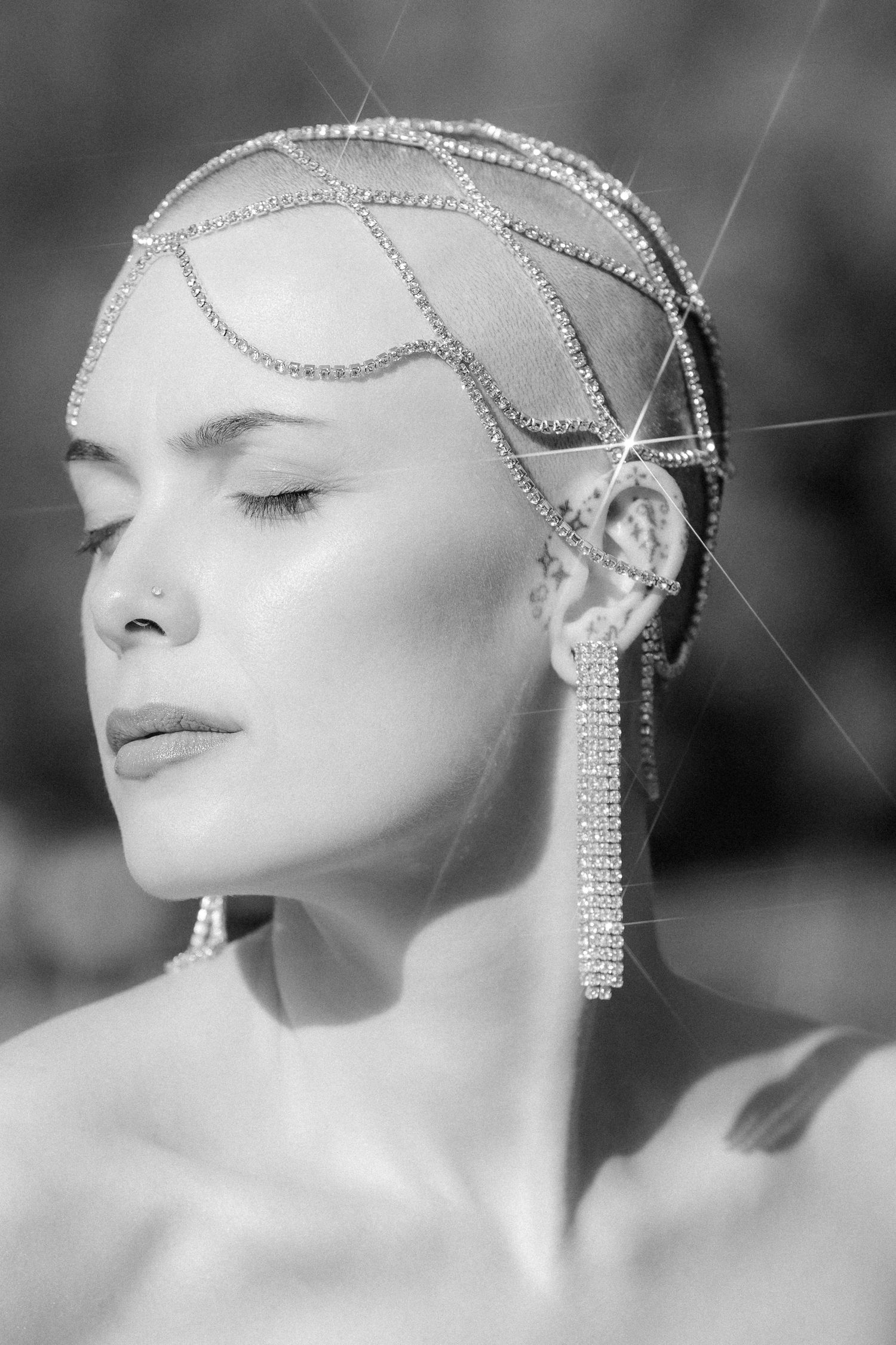 Black and white artistic portrait series featuring delicate crystal hair jewelry and dramatic side lighting.