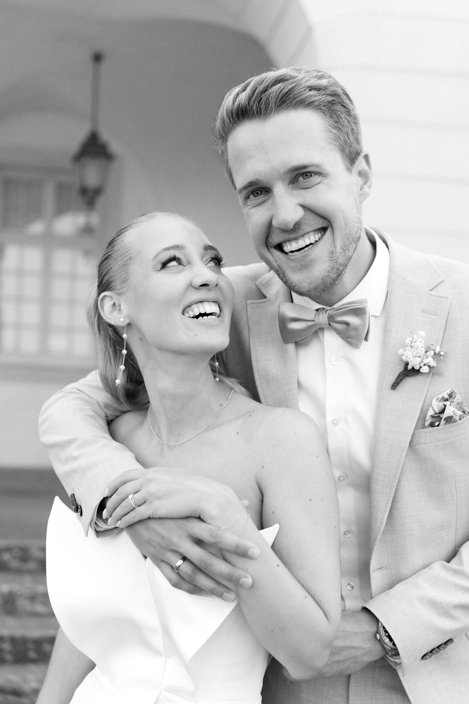 Black and white wedding photos showing romantic moments between a couple in formal attire. Schloss Solitude