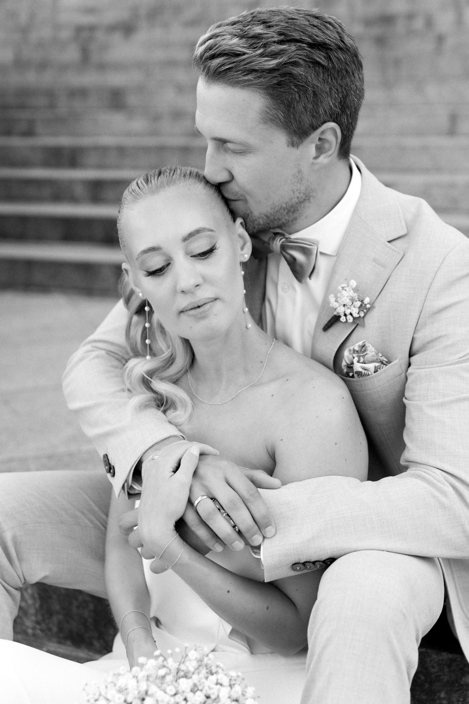 A romantic black and white photo series showing tender moments between a bride and groom on their wedding day. Schloss Solitude