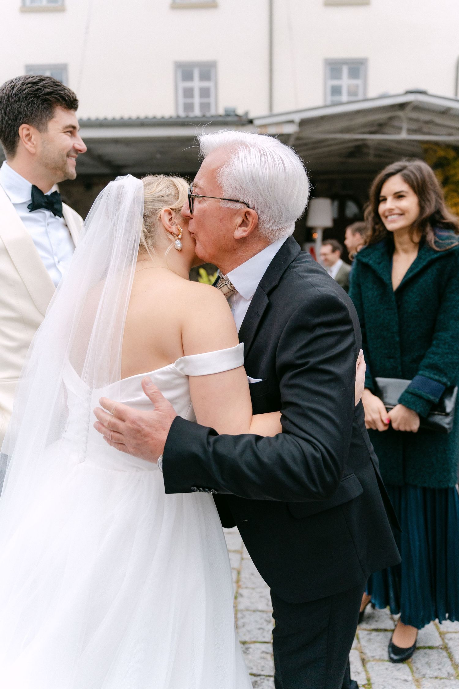 A series of wedding photos showing tender moments between people at an outdoor celebration.