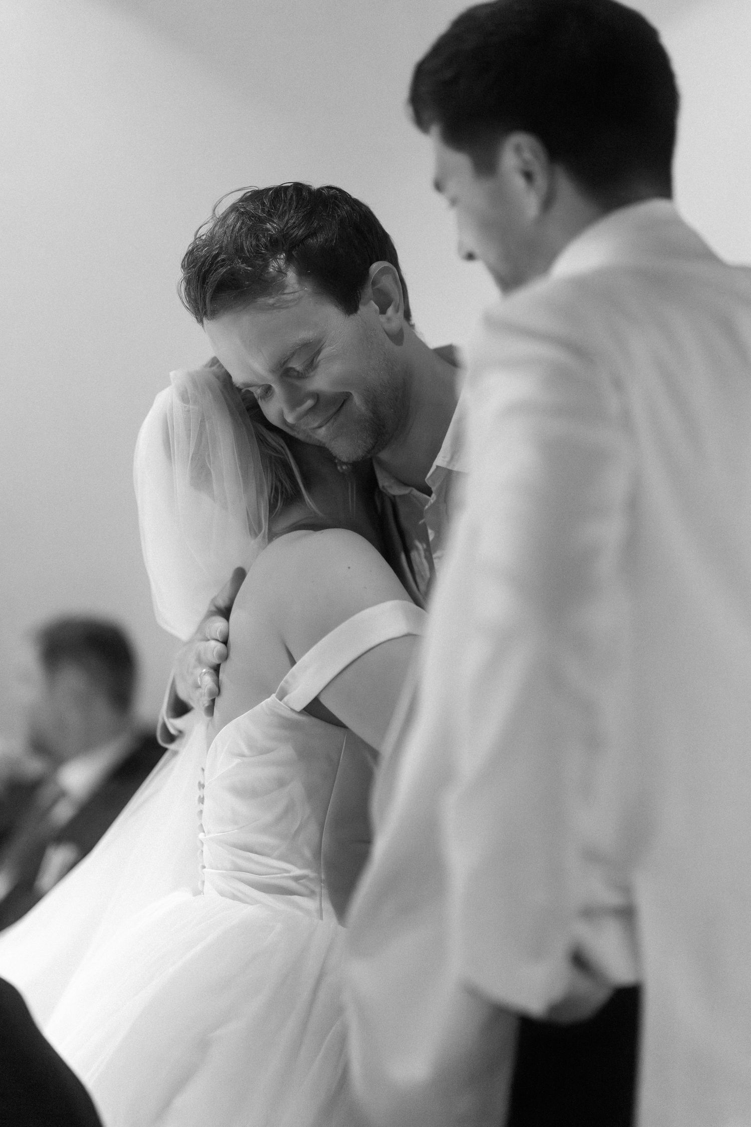 Tender black and white dance moment at an elegant wedding celebration.