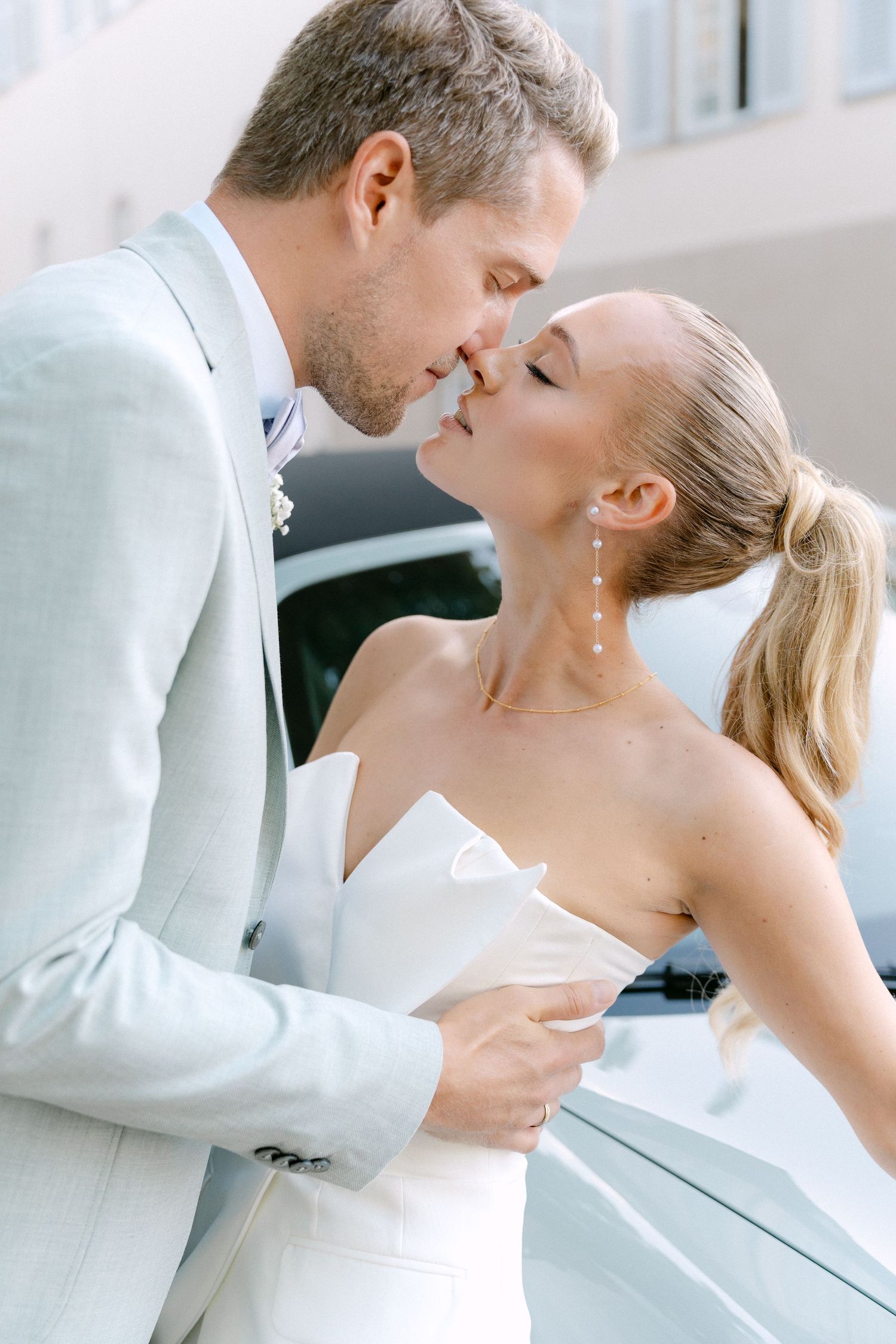 A romantic sequence of a couple in white formal attire embracing and sharing an intimate moment. Schloss Solitude