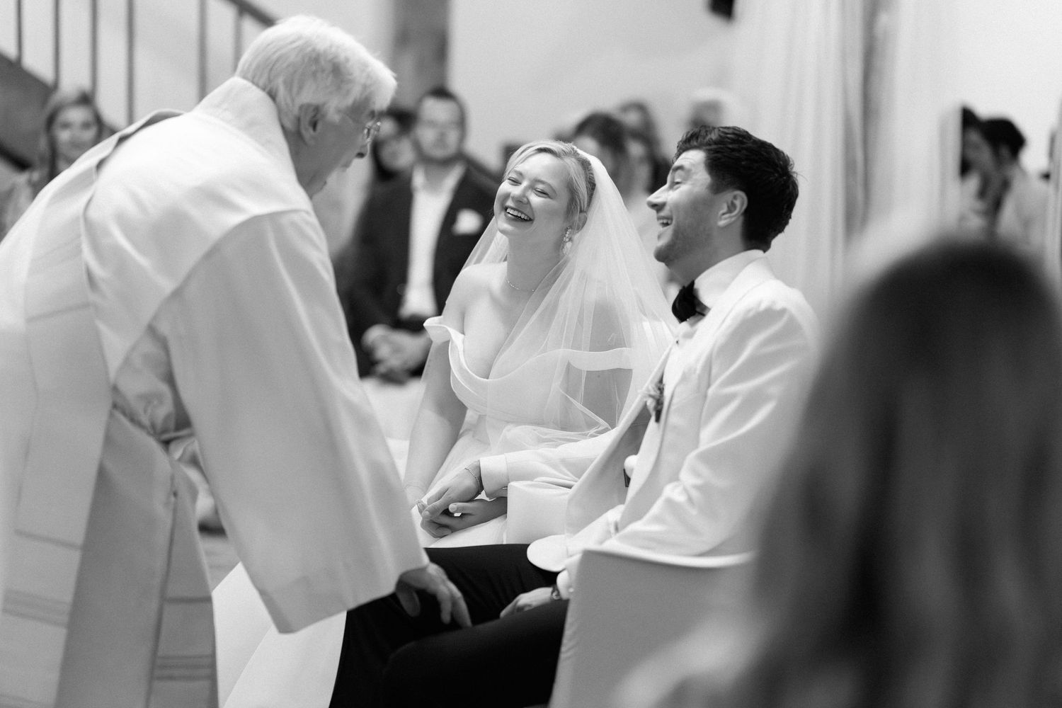 A series of black and white wedding photos showing couples dancing and celebrating at a reception.