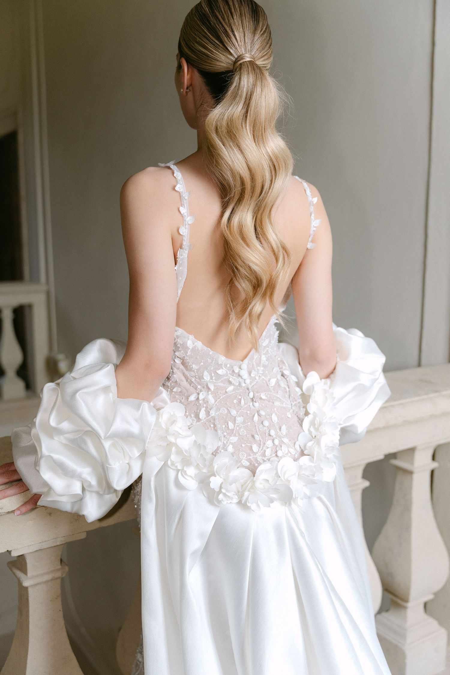 White ruffled wedding dress with delicate lace straps and open back detail shown from multiple angles. Wedding Verona