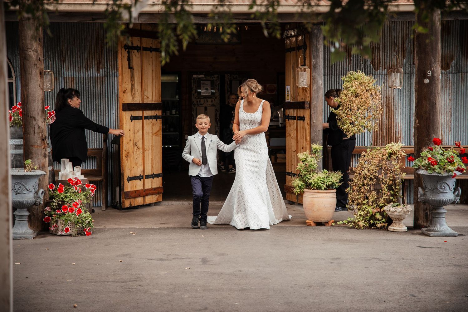 A series of wedding moments captured in a rustic barn setting with wooden details and natural light. Wedding photography
