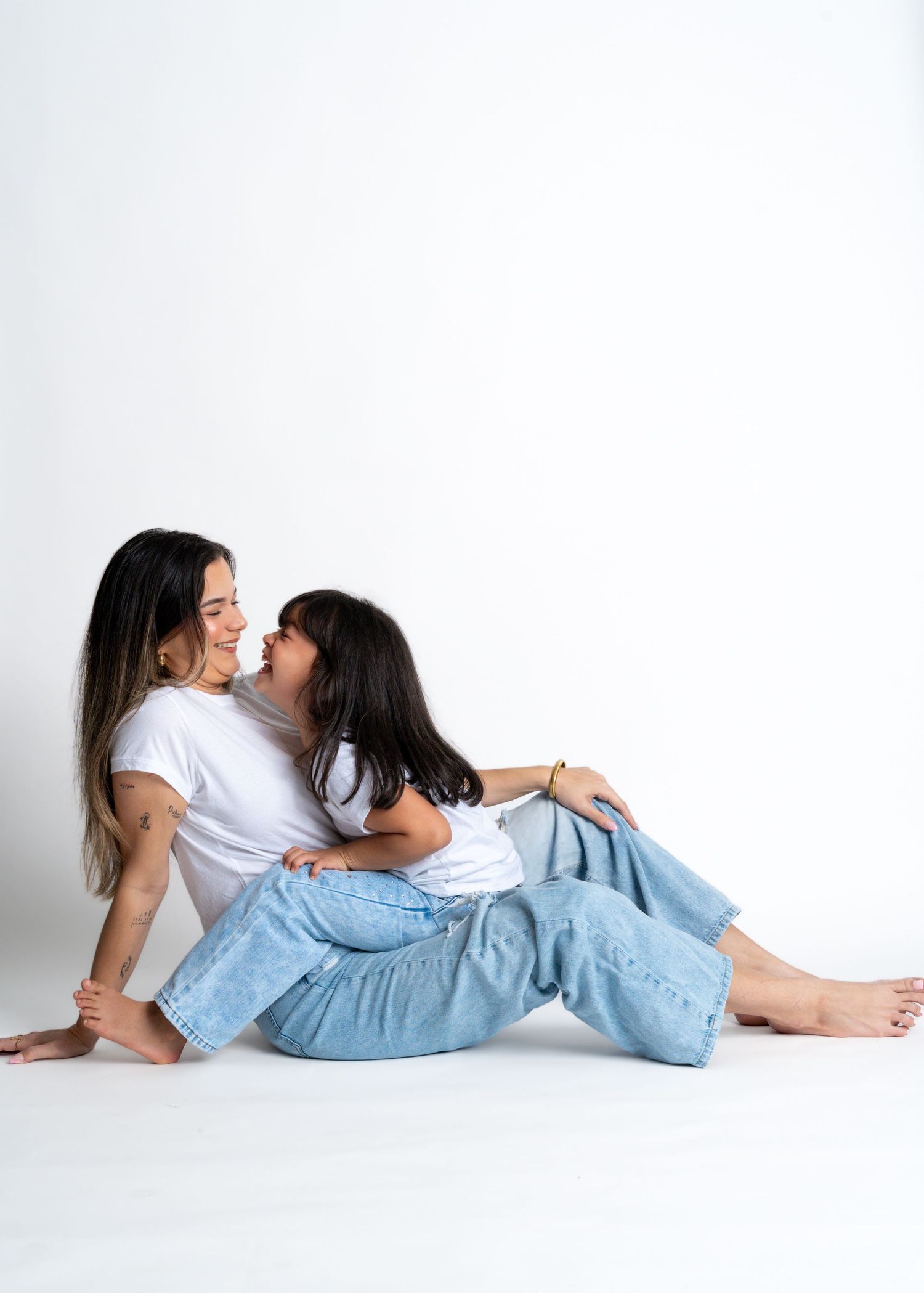 Candid lifestyle photography with people in casual denim and white tops.