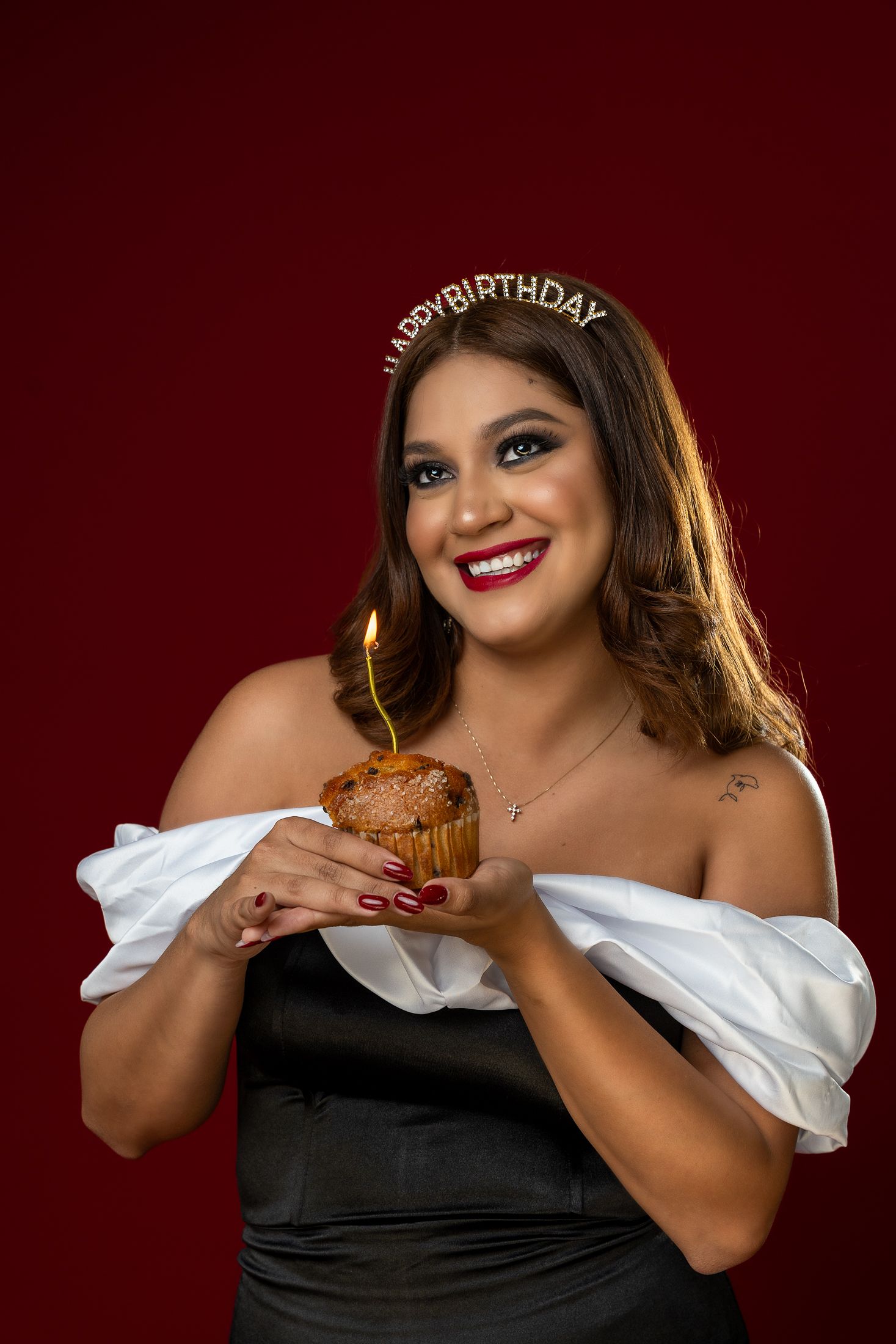 Birthday themed photoshoot with cupcake and celebratory styling.