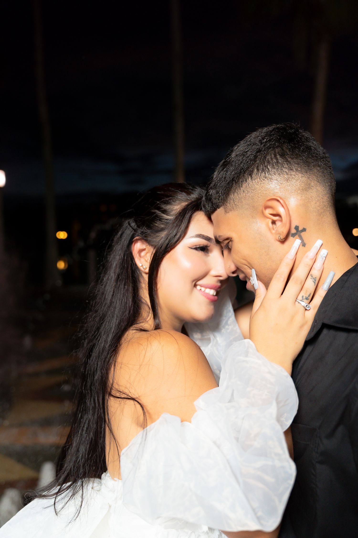 An intimate moment captured between a couple sharing laughter and joy.