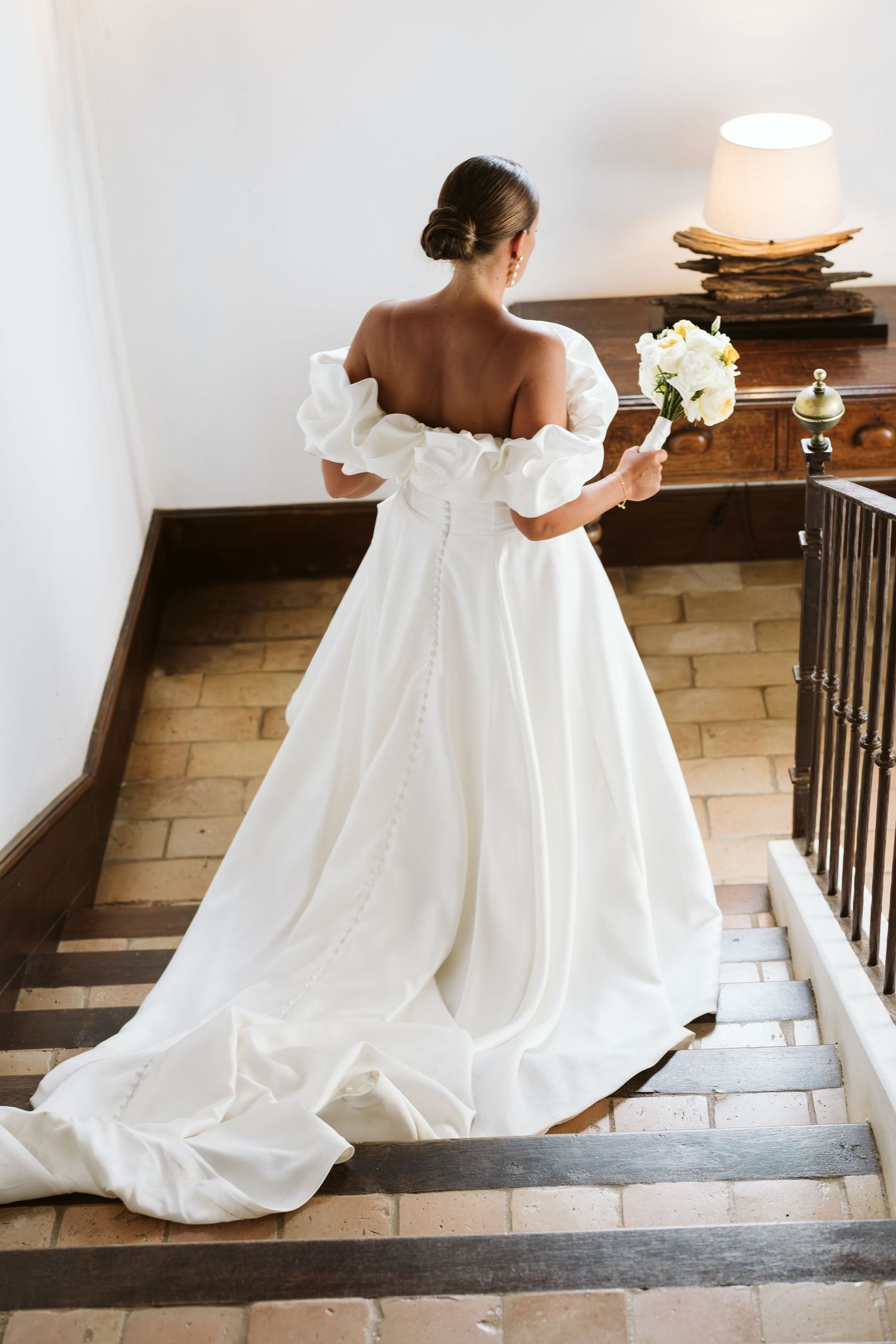 Bride walking down the stairs at Finca Monasterio