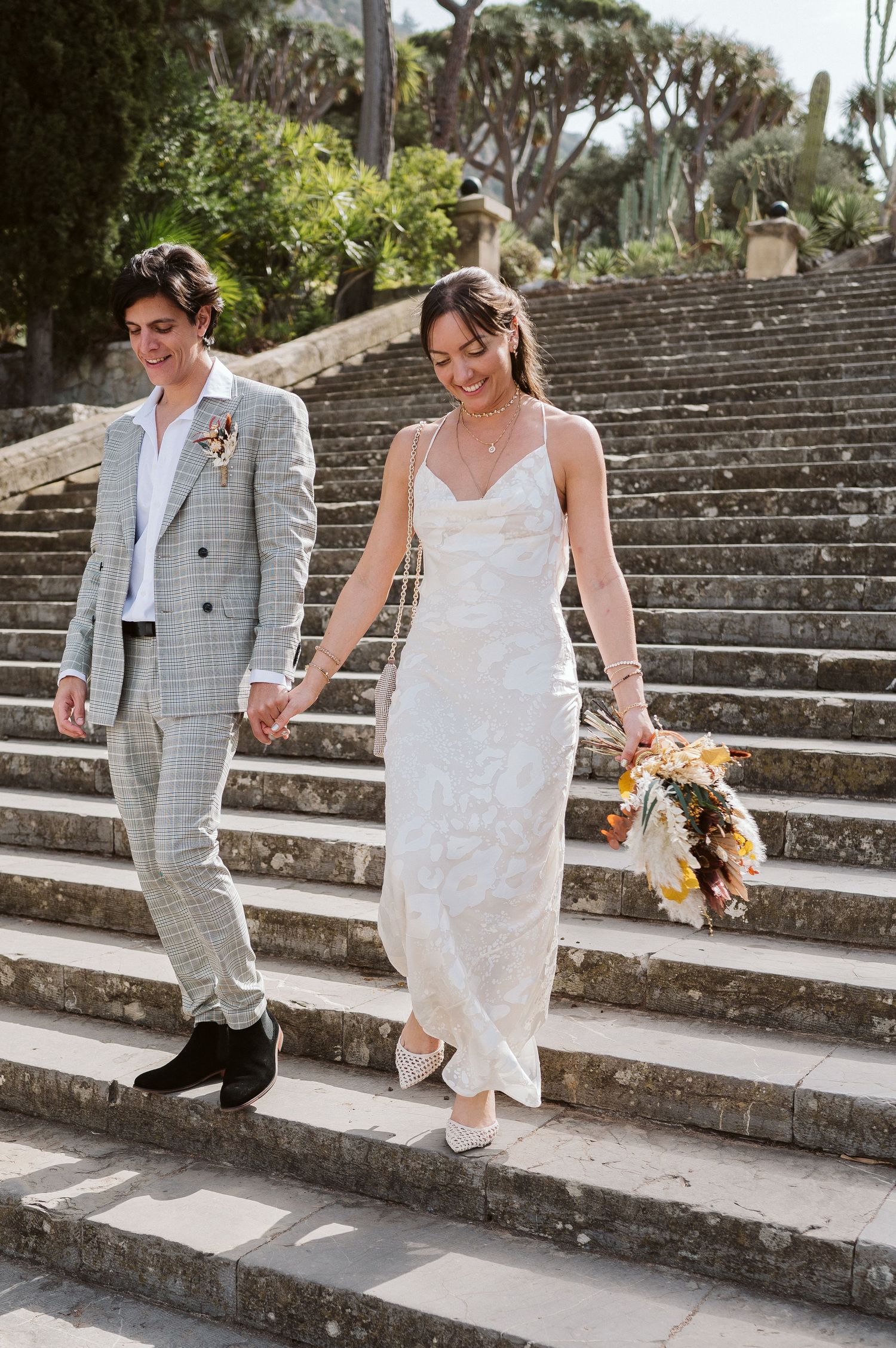 bride and groom walking down the stairs at Alameda Gardens