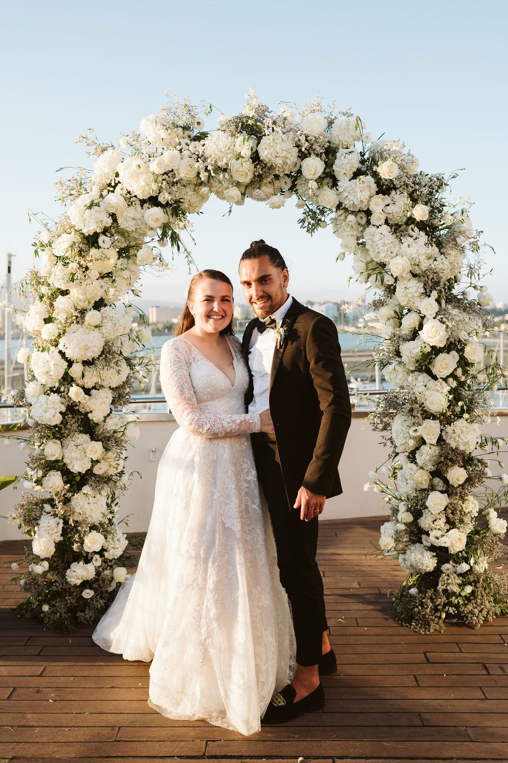 Bride and groom on Sunborn Hotel terrace overlooking Ocean Village