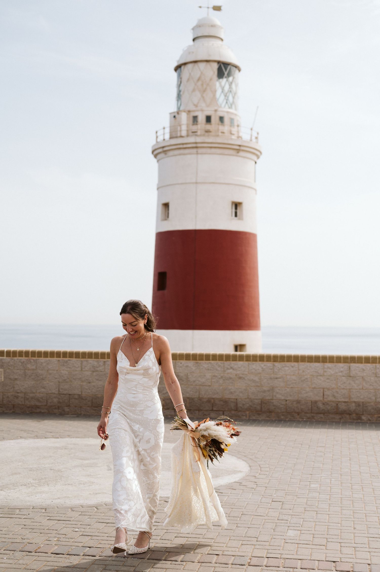 Bride walking at the Lighthouse