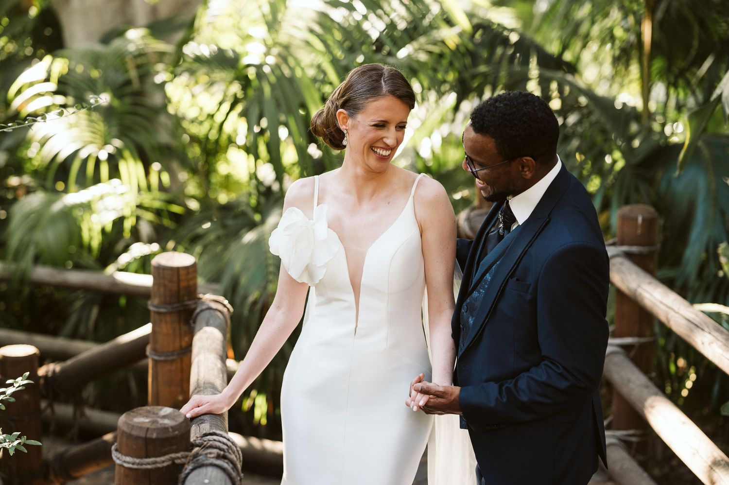 Bride and groom smiling at each other at the Alameda Gardens