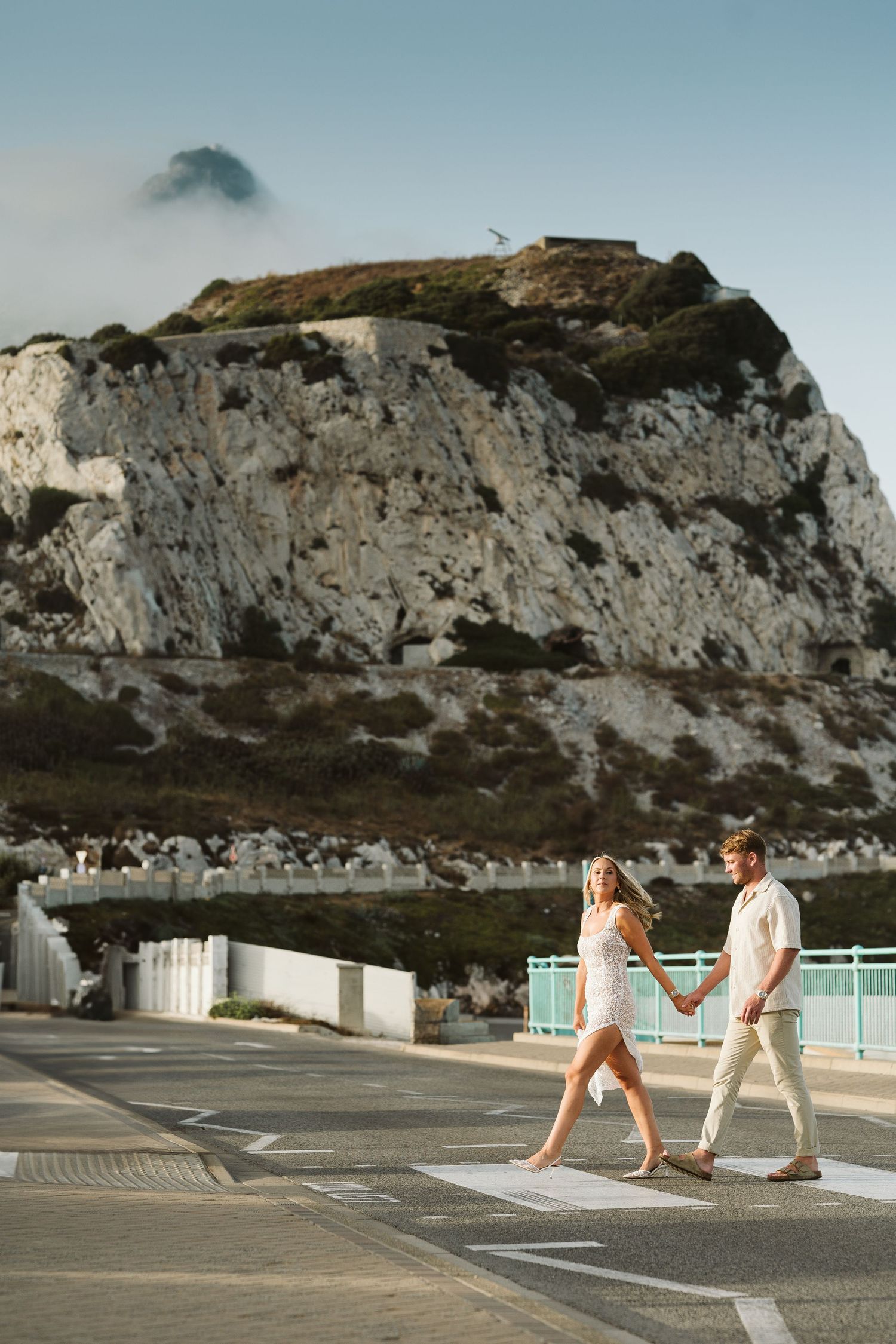 bride crossing the street at the Europa Point