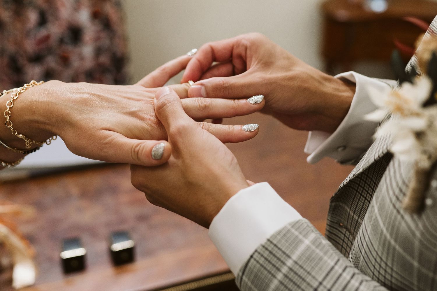 Groom putting the ring on the finger at the registry office in Gibraltar