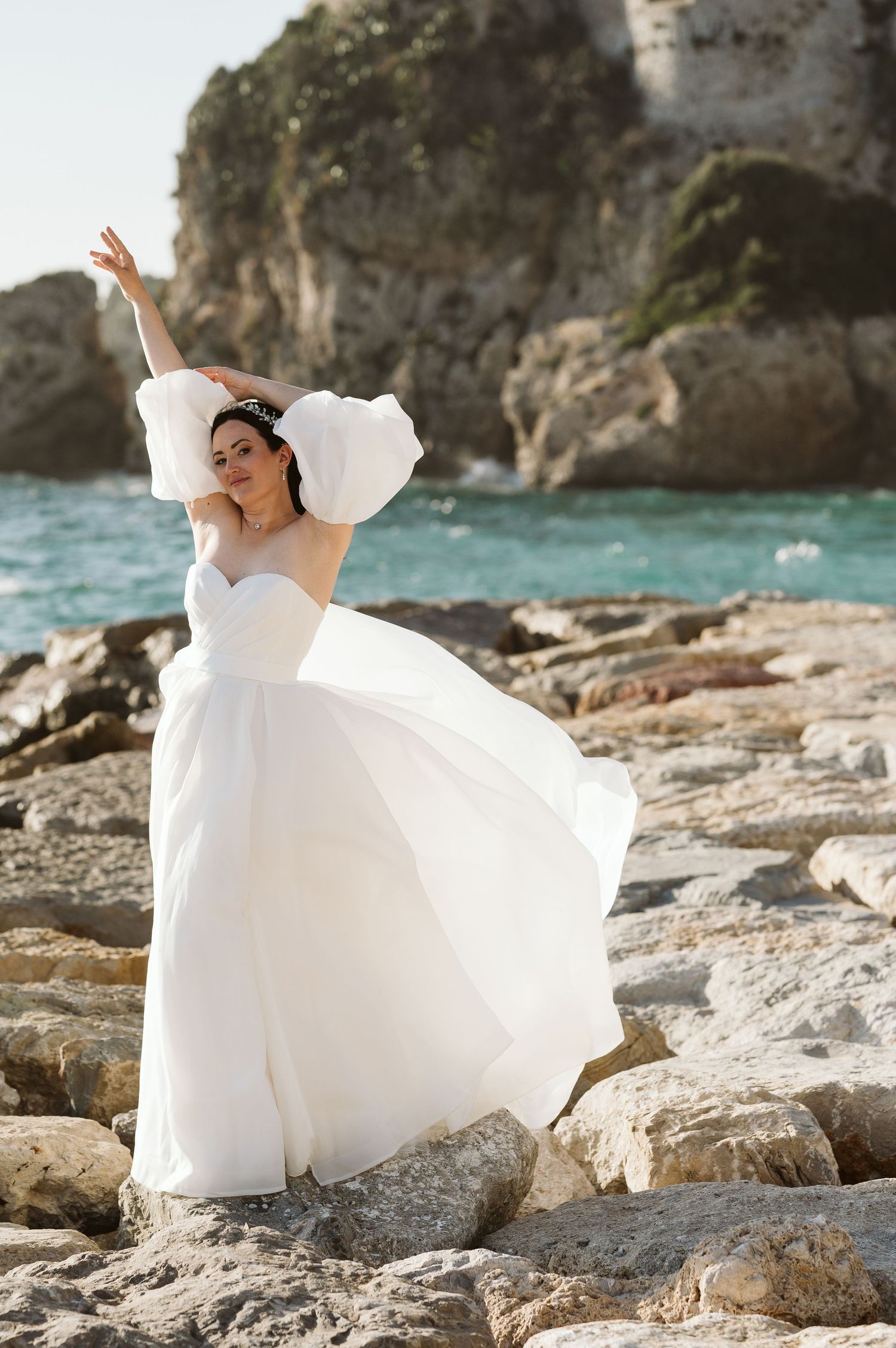 Bride dancing in sunset light at the Camp Bay