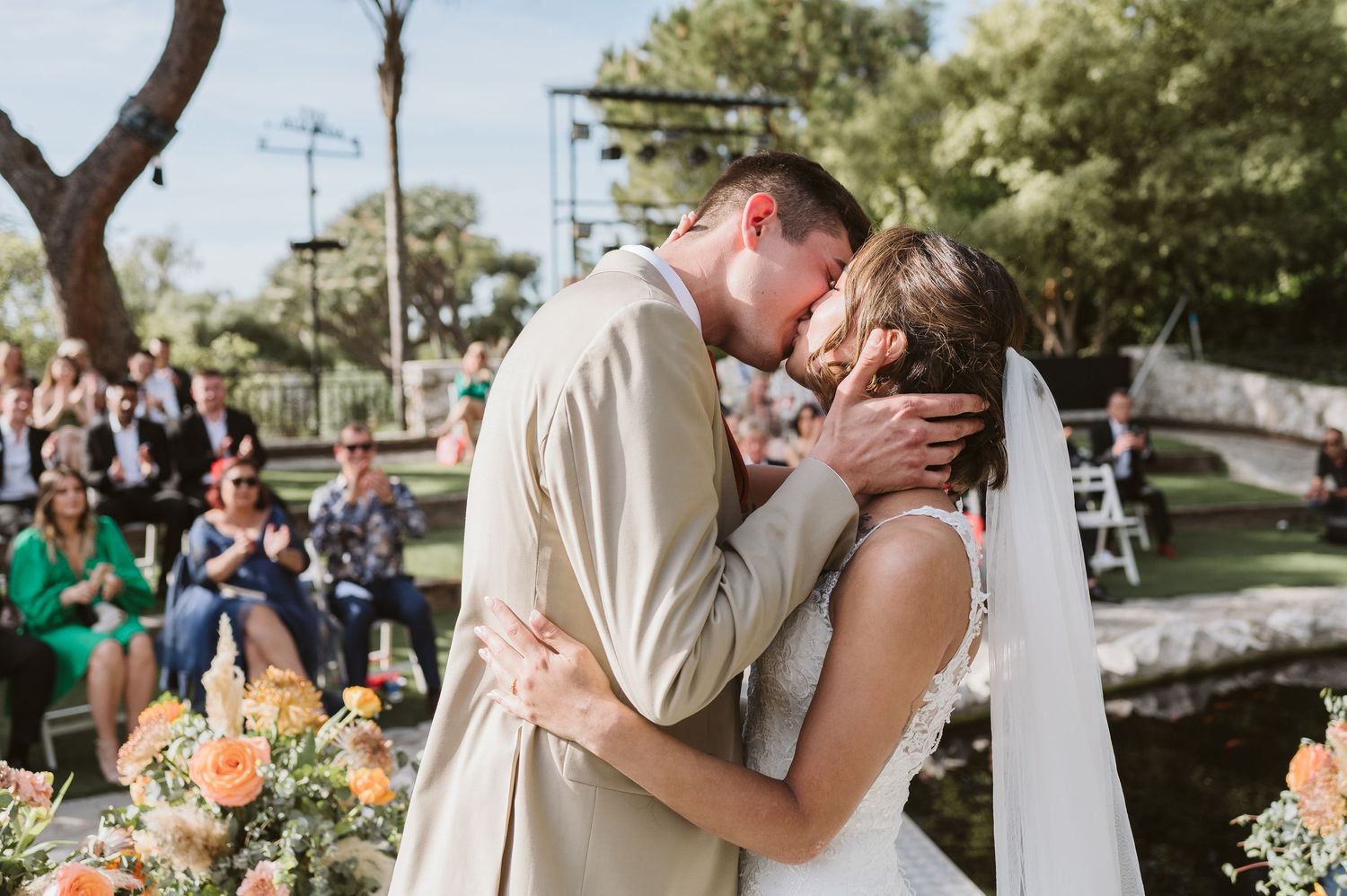 bride and groom first kiss during the ceremony at the Open Air Theatre in Gibraltar