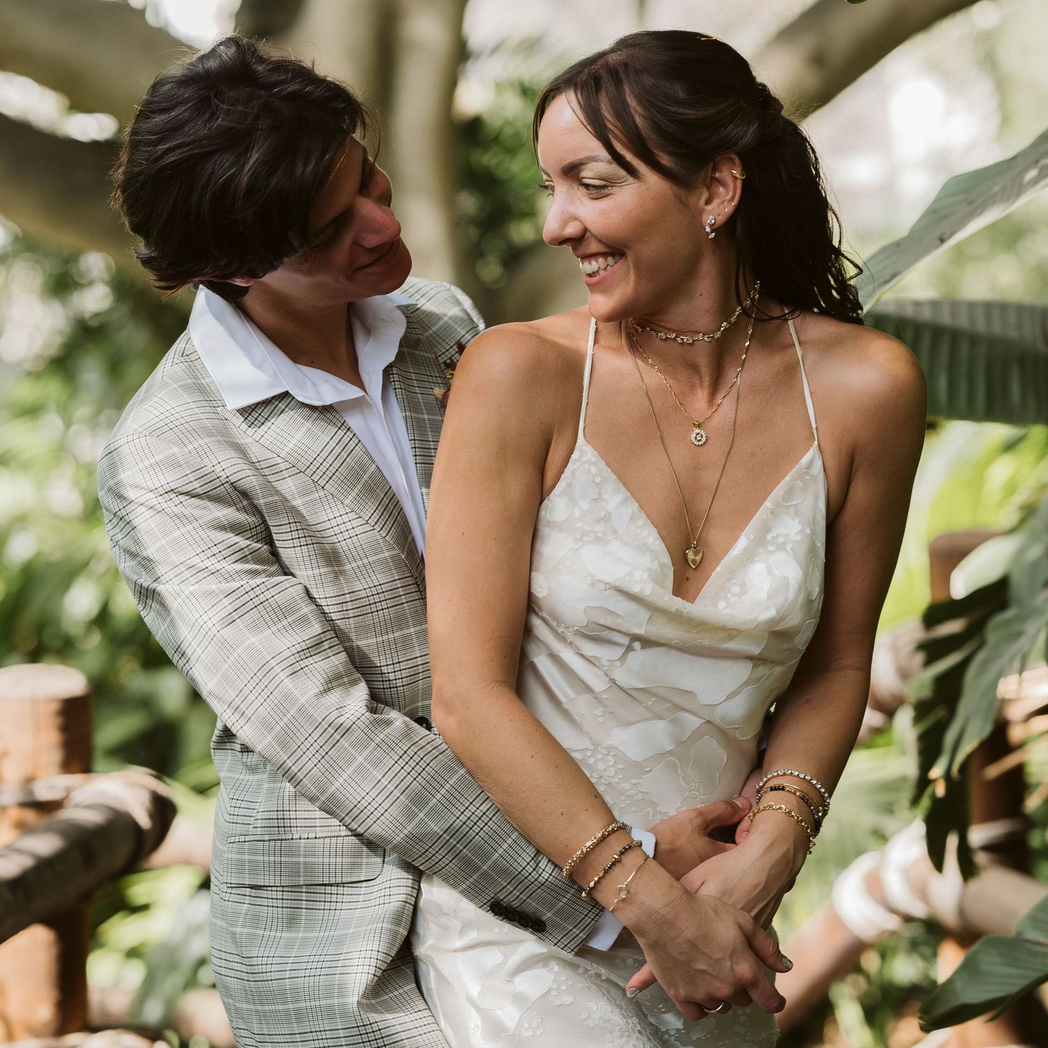 Bride and groom looking at each other in a cute pose