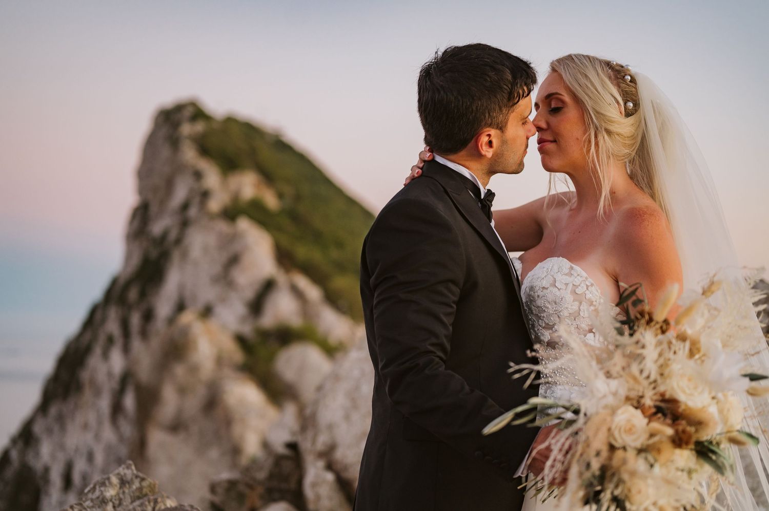 Bride and groom with the Rock in the background