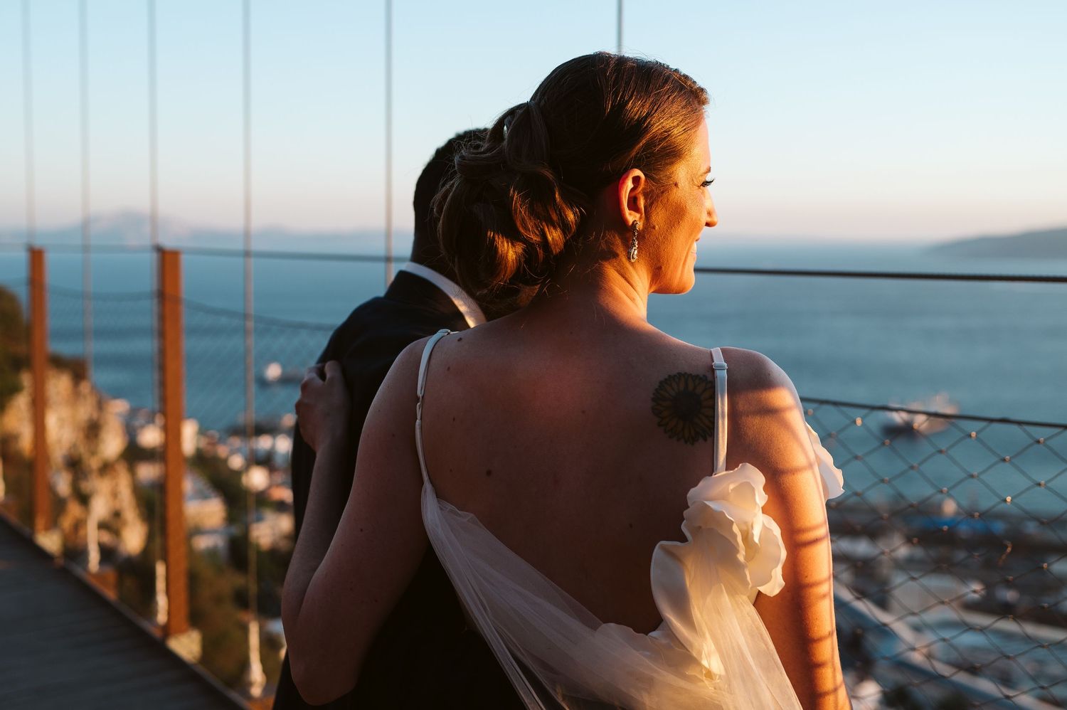 bride looking away at Suspension Bridge in gibraltar