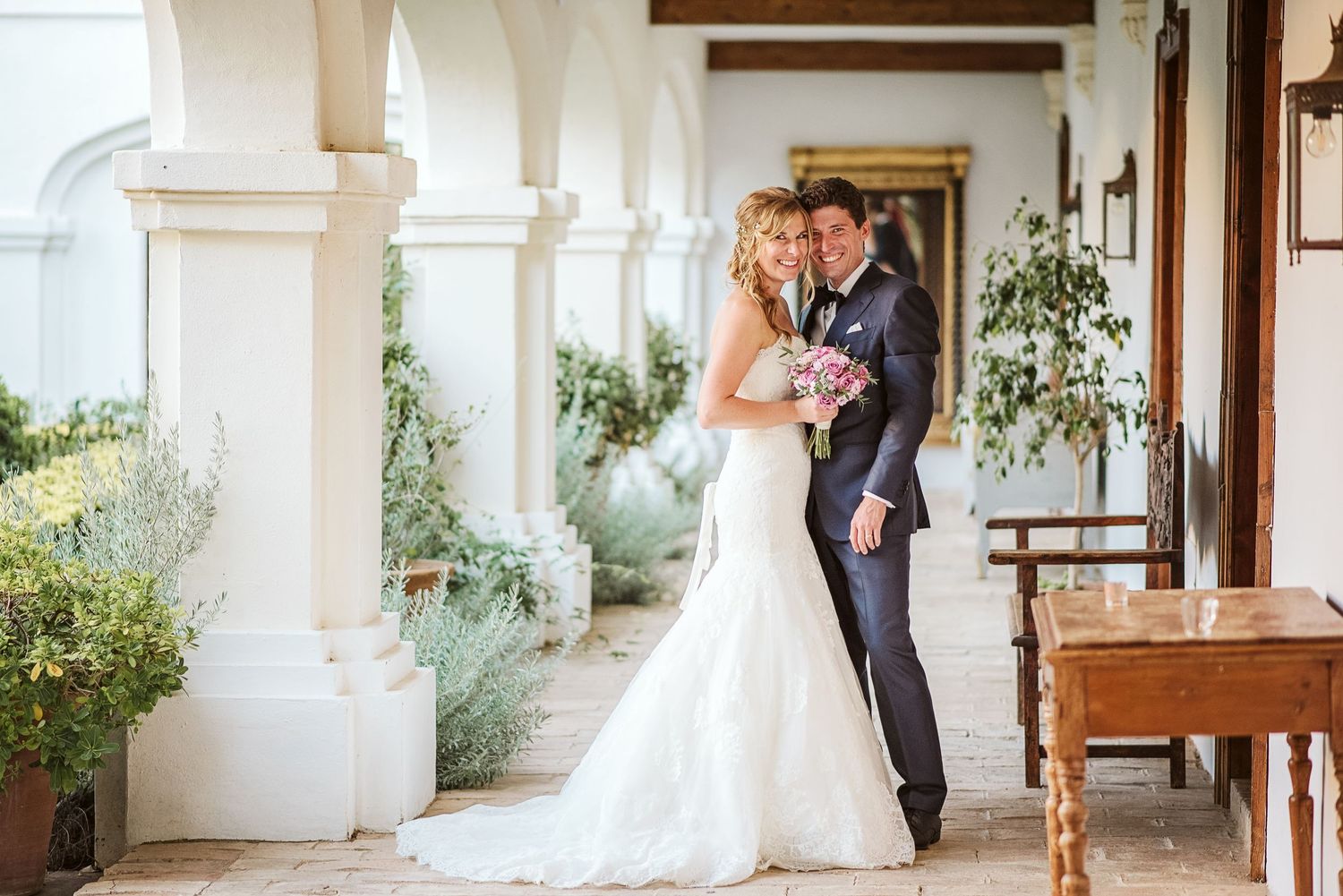 Bride and groom posing for a photo at Finca Monasterio