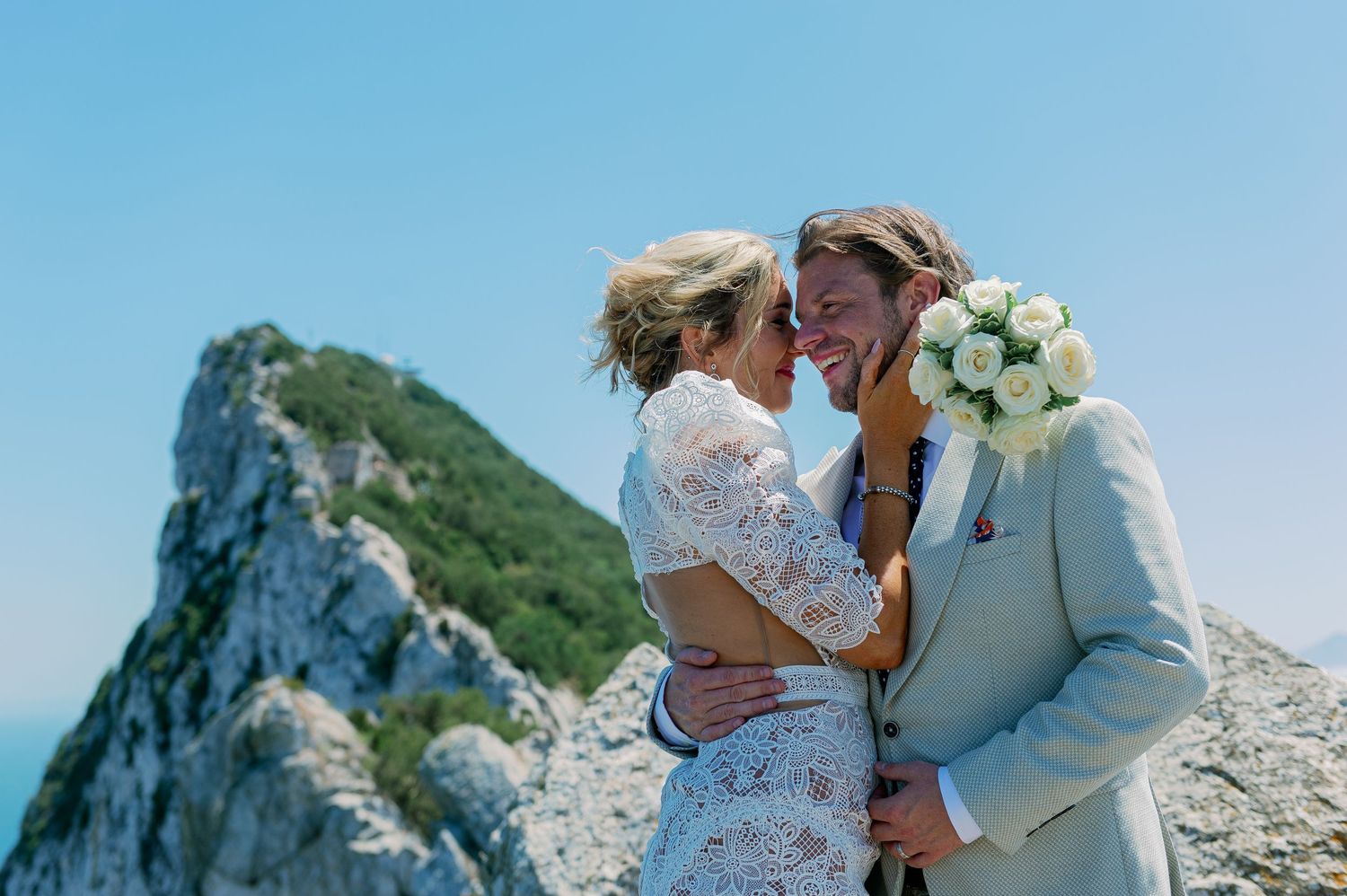 Groom and bride hugging