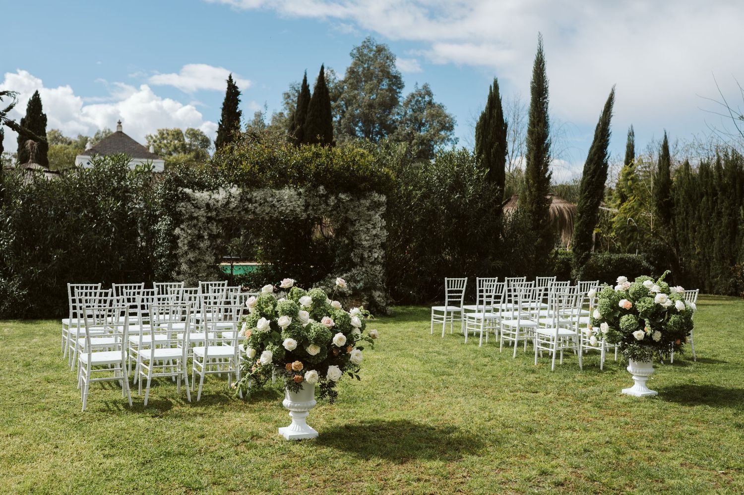 ceremony flowers and chairs setup at Finca Monasterio